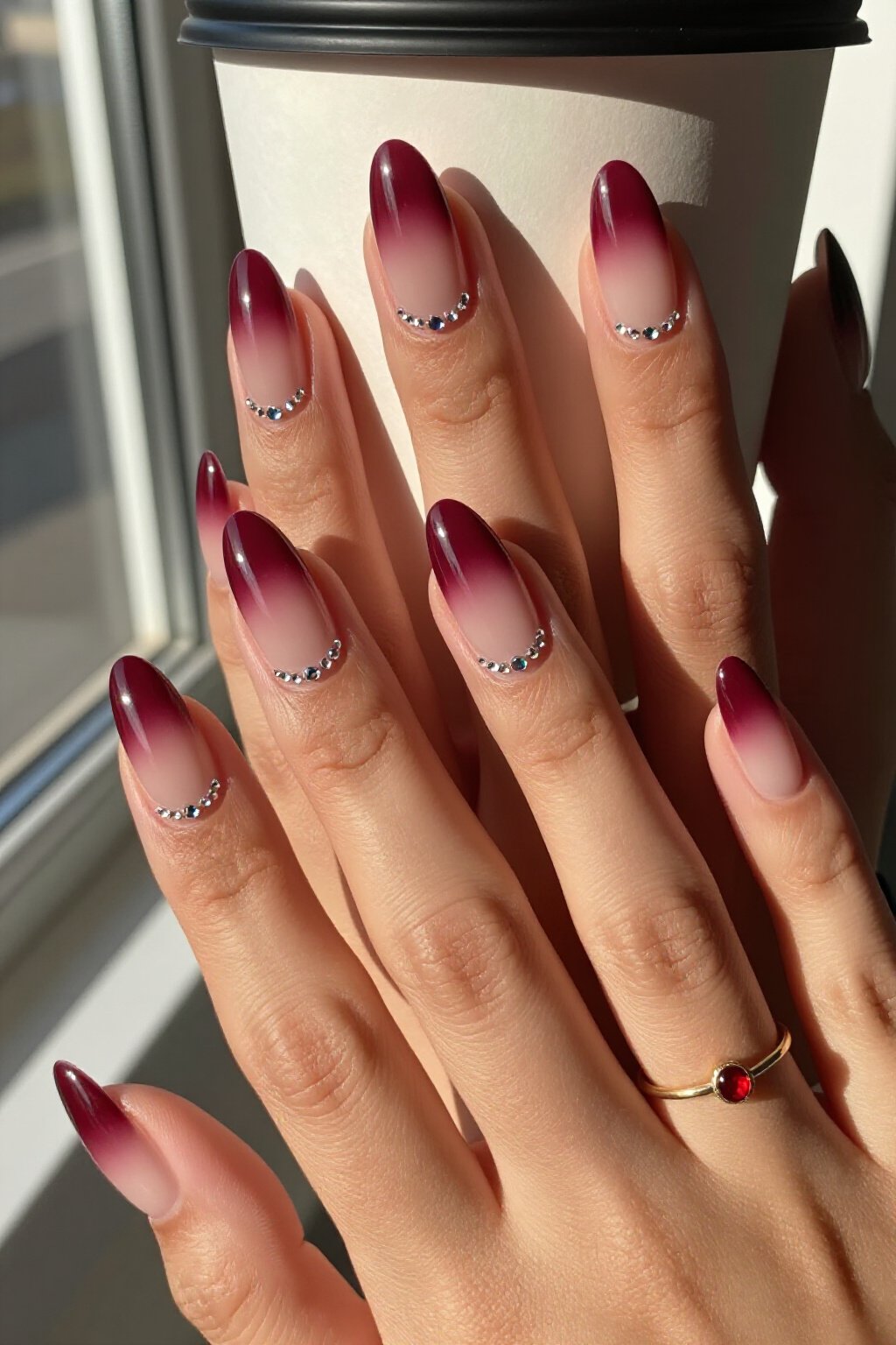 Glamorous Burgundy Almond Aura Nails with Crystal Embellishments: How to Make It Last Longer - almond aura nails Glamorous Burgundy Almond Aura Nails with Crystal Embellishments: How to Make It Last Longer - almond aura nails