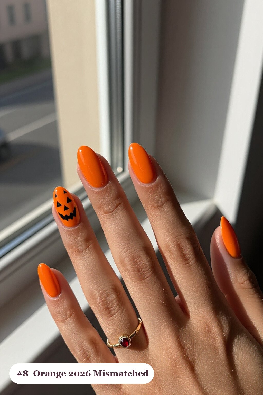Mismatched Orange Oval Nails: Every Finger a Unique Pattern - 2026 halloween acrylic nails Mismatched Orange Oval Nails: Every Finger a Unique Pattern - 2026 halloween acrylic nails