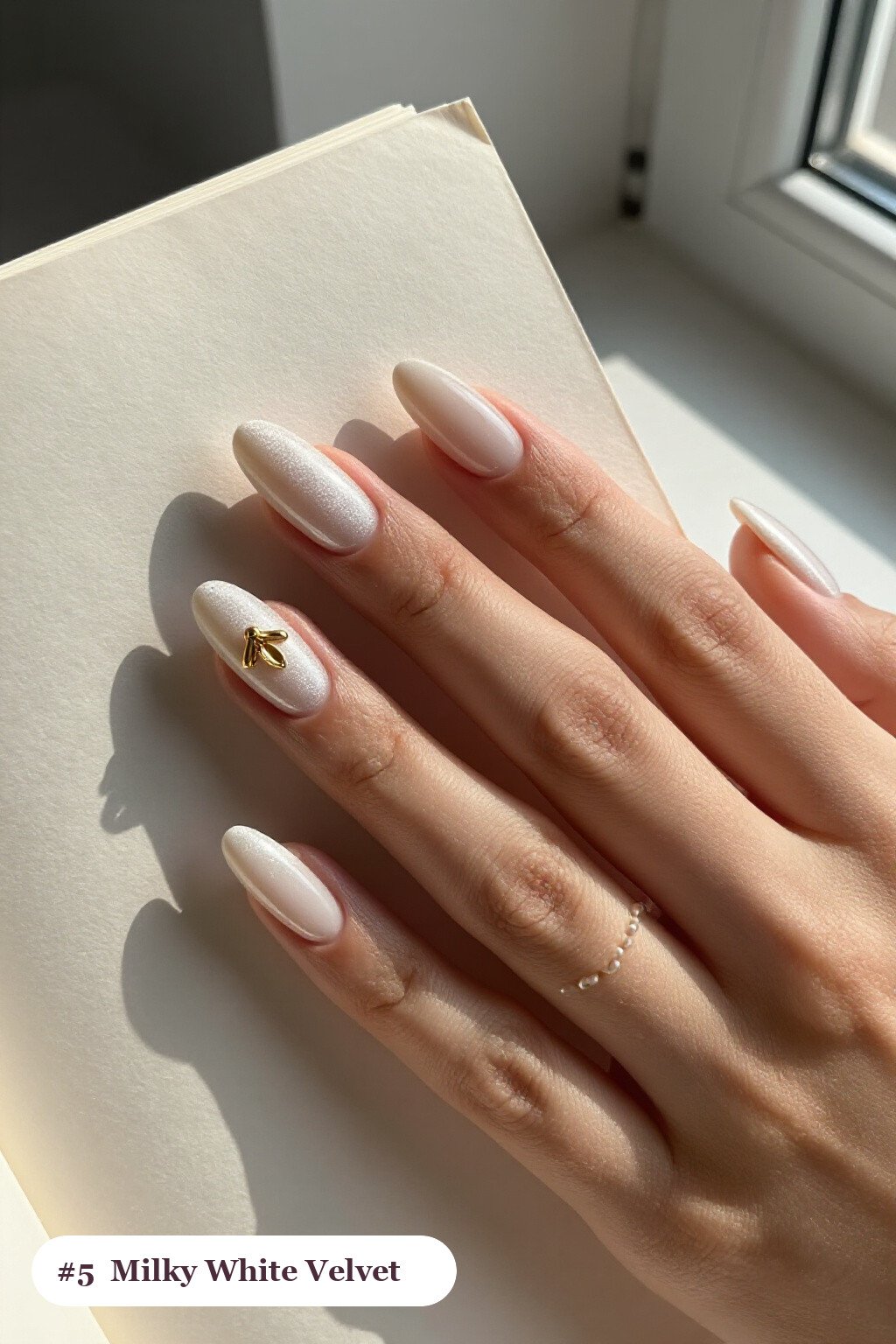Milky White Velvet Shimmer with Gold Charm Accent - almond nails
