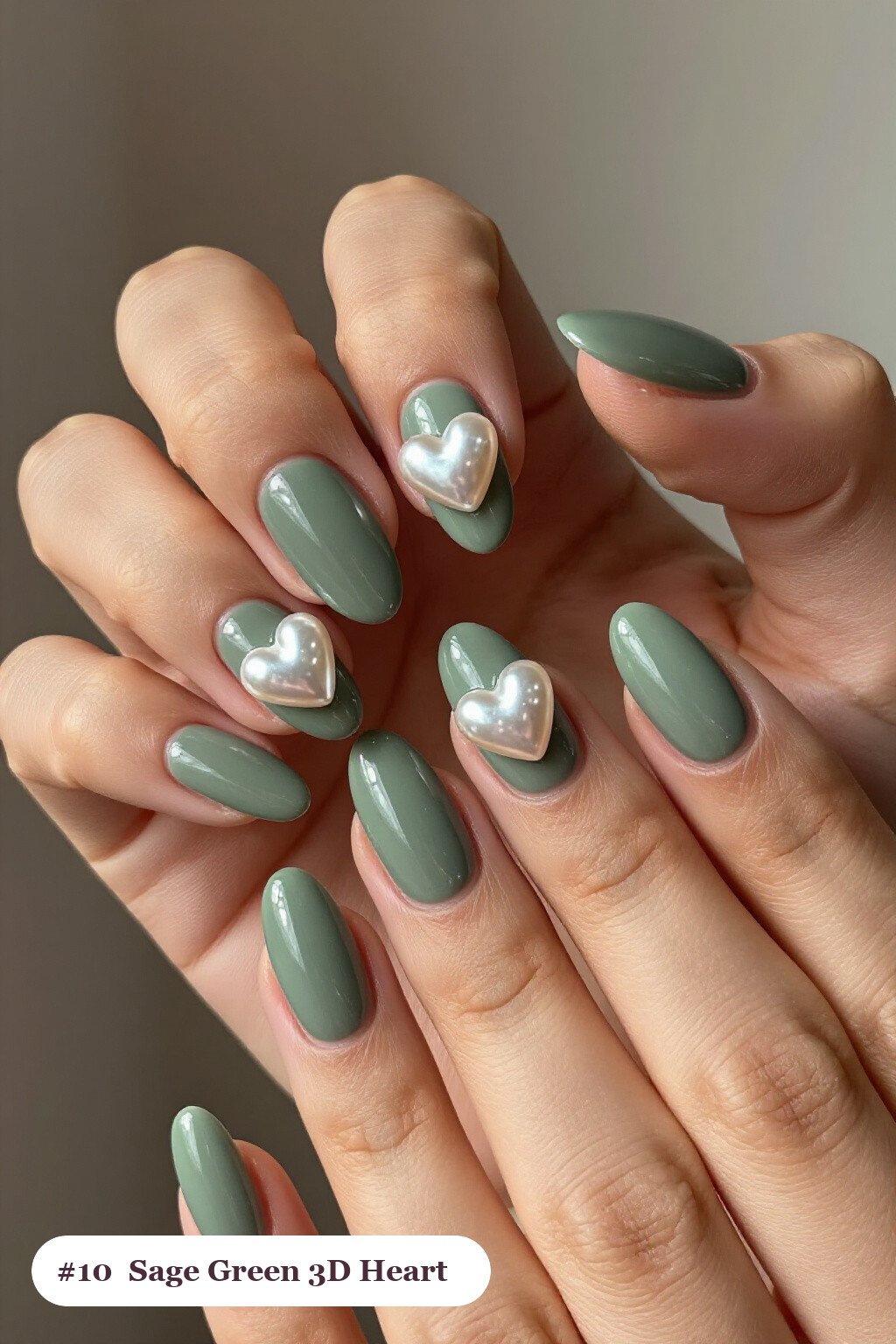 Sage Green Almond Nails Adorned with 3D Hearts and Pearls - almond nails designs Sage Green Almond Nails Adorned with 3D Hearts and Pearls - almond nails designs