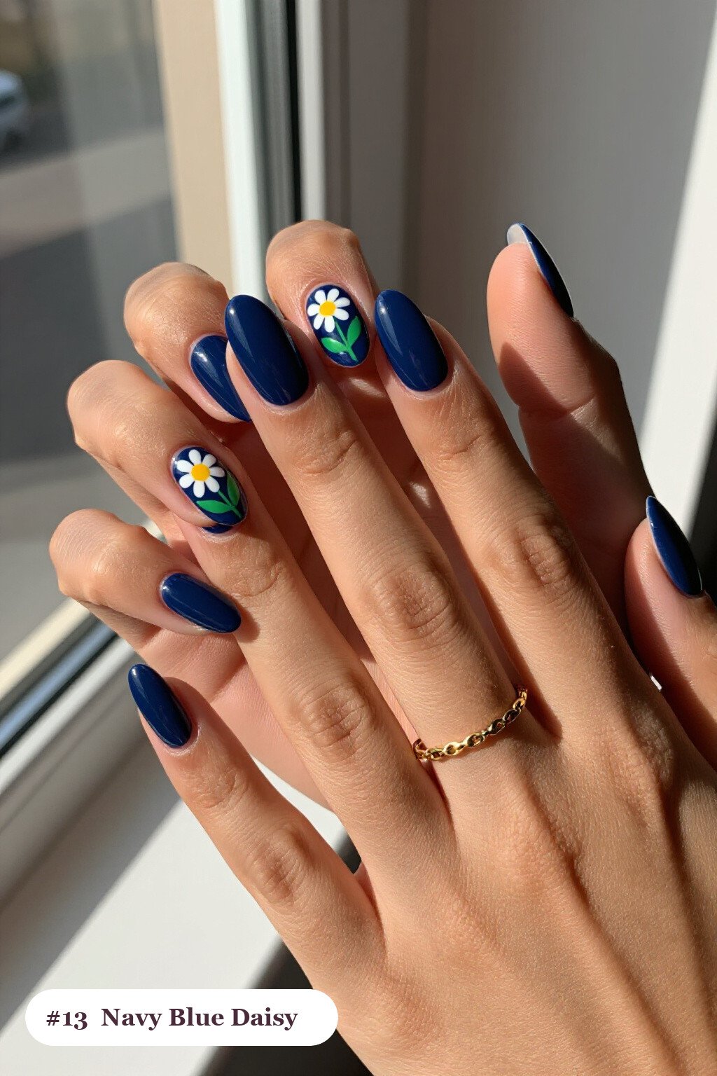 Navy Almond Nails Hand‑Painted with Daisies and Green Leaves - almond nails designs Navy Almond Nails Hand‑Painted with Daisies and Green Leaves - almond nails designs