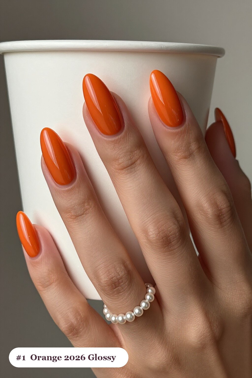 Long almond burnt orange 2026 nails in a flawless mirror-glossy full-colour finish, perfect for autumn - autumn nails 2026