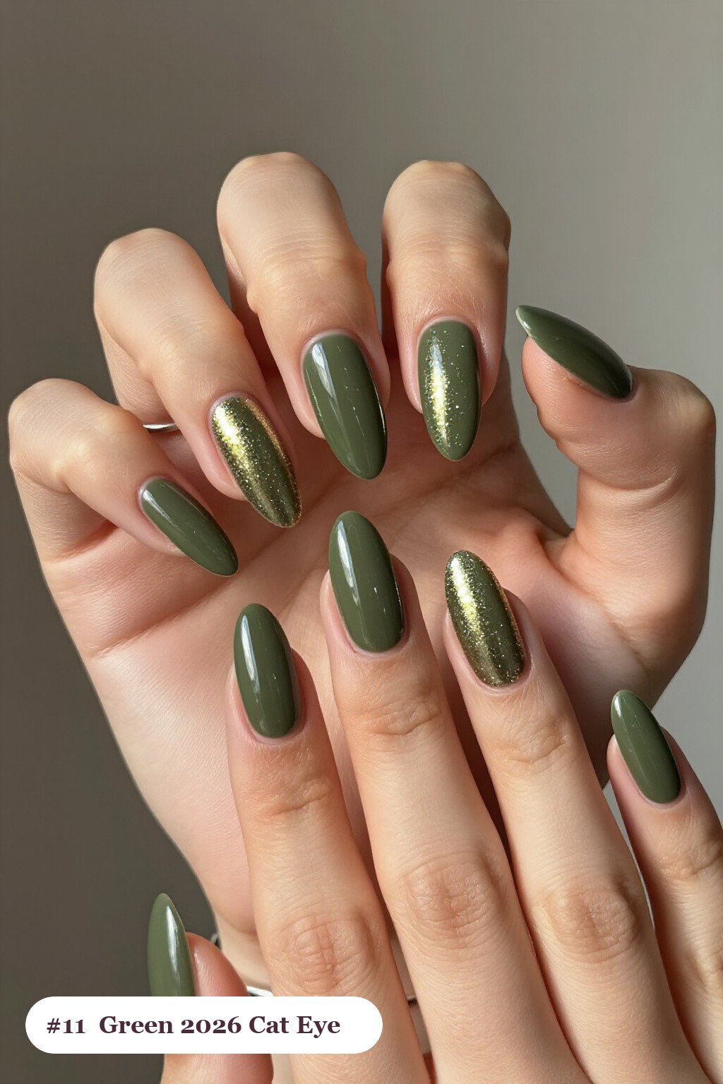 Long almond olive green 2026 nails with a glowing shimmer band of light running down the centre of each nail like a gemstone, perfect for autumn - autumn nails 2026