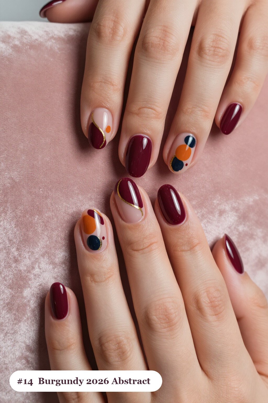 Medium coffin burgundy 2026 nails with abstract art of colour blobs, gold outlines and dots, perfect for autumn - autumn nails 2026