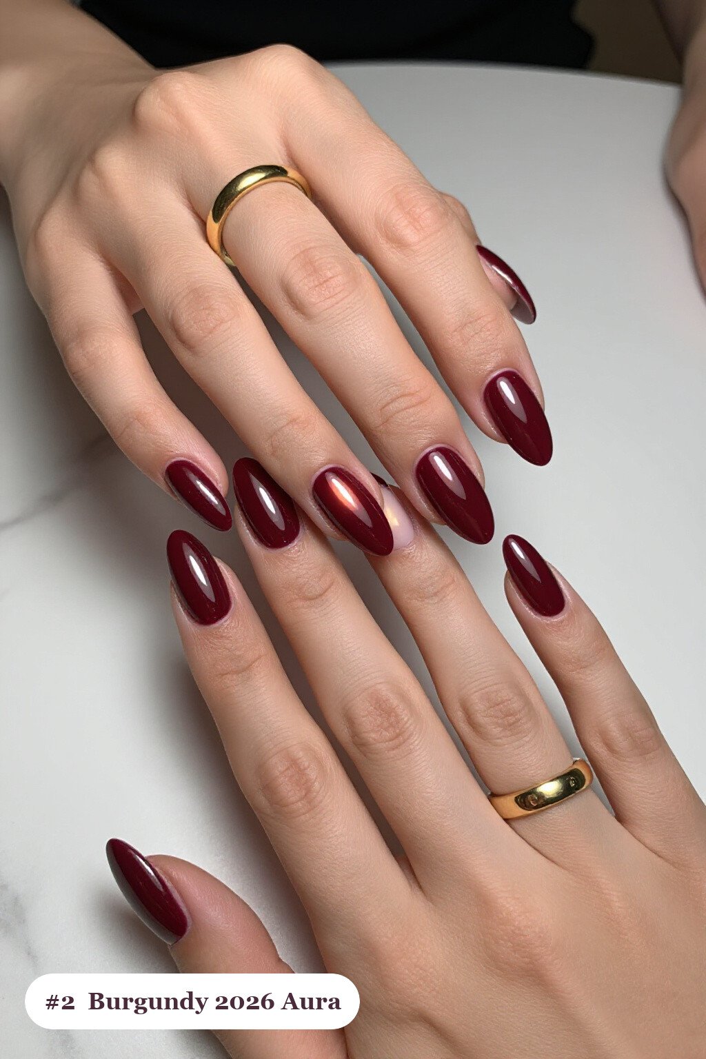 Medium almond burgundy 2026 nails with a glowing airbrushed aura in the centre of each nail, perfect for autumn - autumn nails 2026