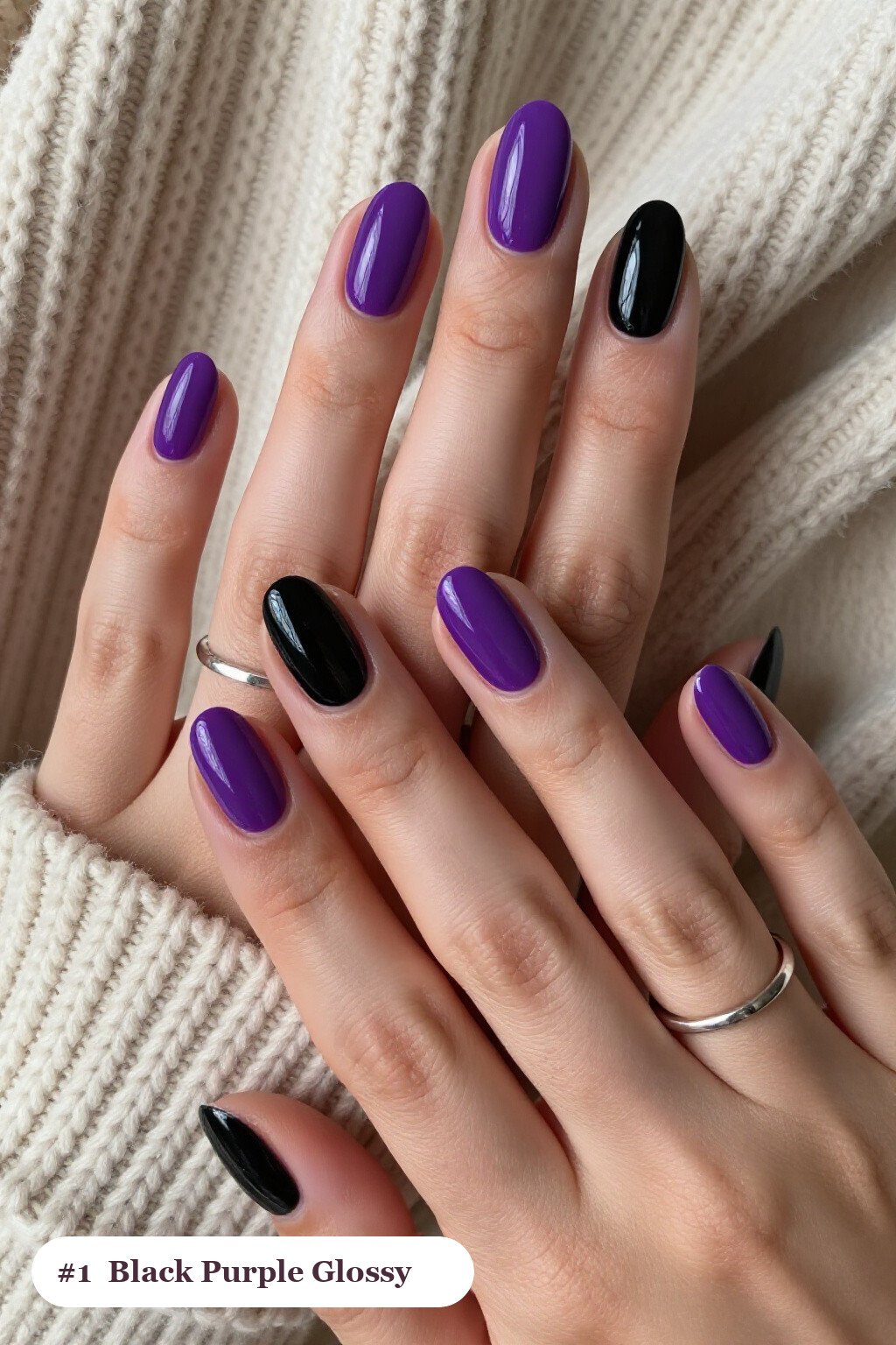 Medium oval black purple nails in a flawless mirror-glossy full-colour finish, perfect for halloween - black and purple halloween nail designs