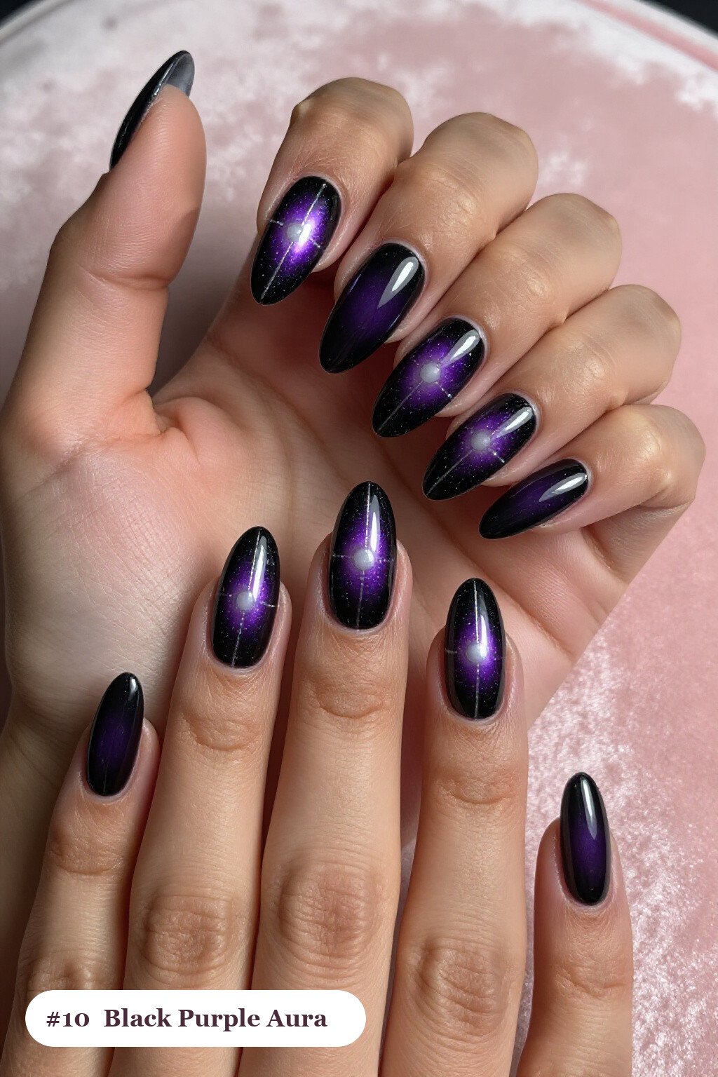 Long coffin black purple nails with a glowing airbrushed aura in the centre of each nail, with silver details, perfect for halloween - black and purple halloween nail designs