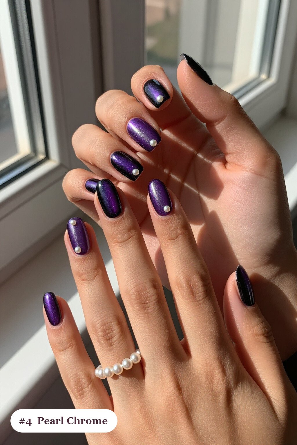 Medium coffin black purple nails with glazed pearl chrome over the colour for an iridescent sheen, with pearl details, perfect for halloween - black and purple halloween nail designs
