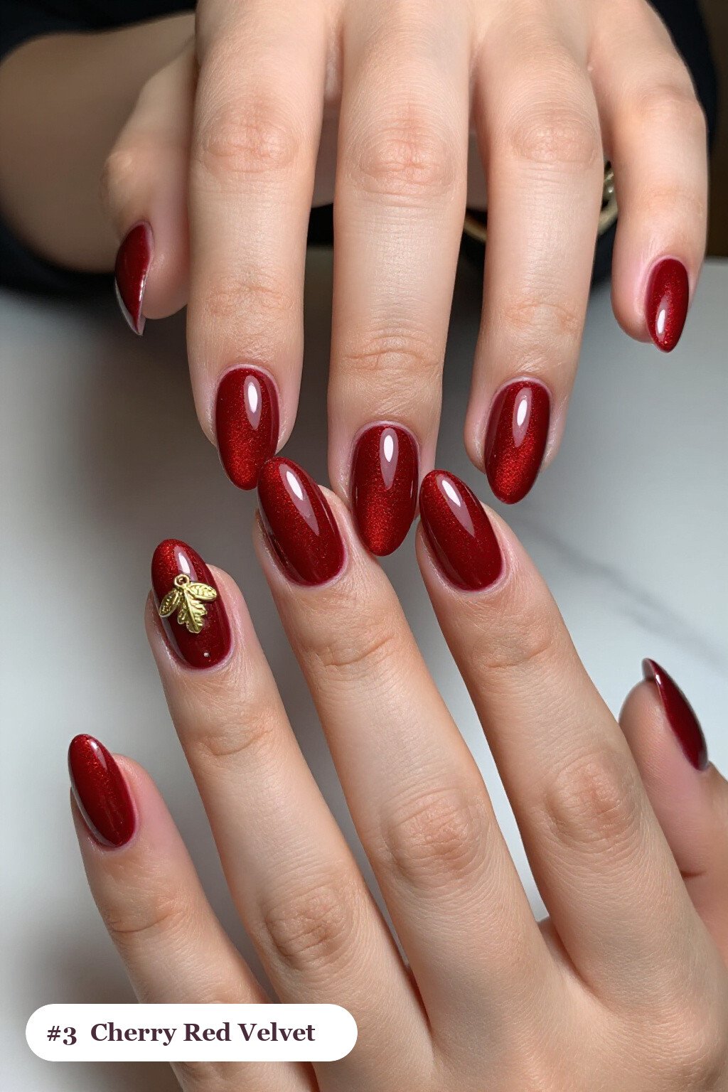 Cherry Red Velvet Shimmer Almond Nails with Gold Charm Accent – Christmas Ready - christmas almond nails short Cherry Red Velvet Shimmer Almond Nails with Gold Charm Accent – Christmas Ready - christmas almond nails short