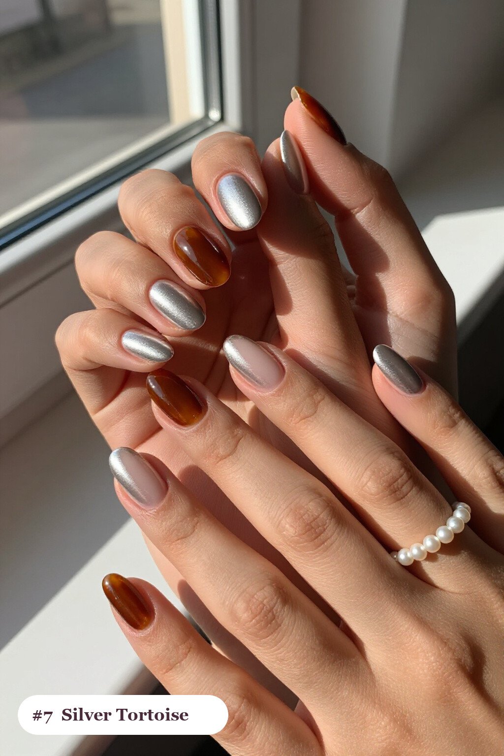 Silver Almond Nails Paired with Amber Tortoiseshell Accents – Subtle Festive Shine - christmas almond nails short Silver Almond Nails Paired with Amber Tortoiseshell Accents – Subtle Festive Shine - christmas almond nails short