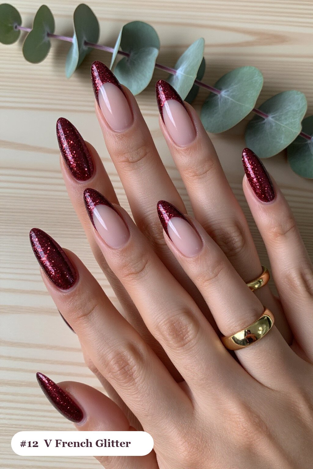 Long ballerina burgundy glitter nails with sparkling glitter clearly visible on every nail, styled with deep V-shaped french tips in a bold contrasting colour, perfect for christmas - christmas glitter nails