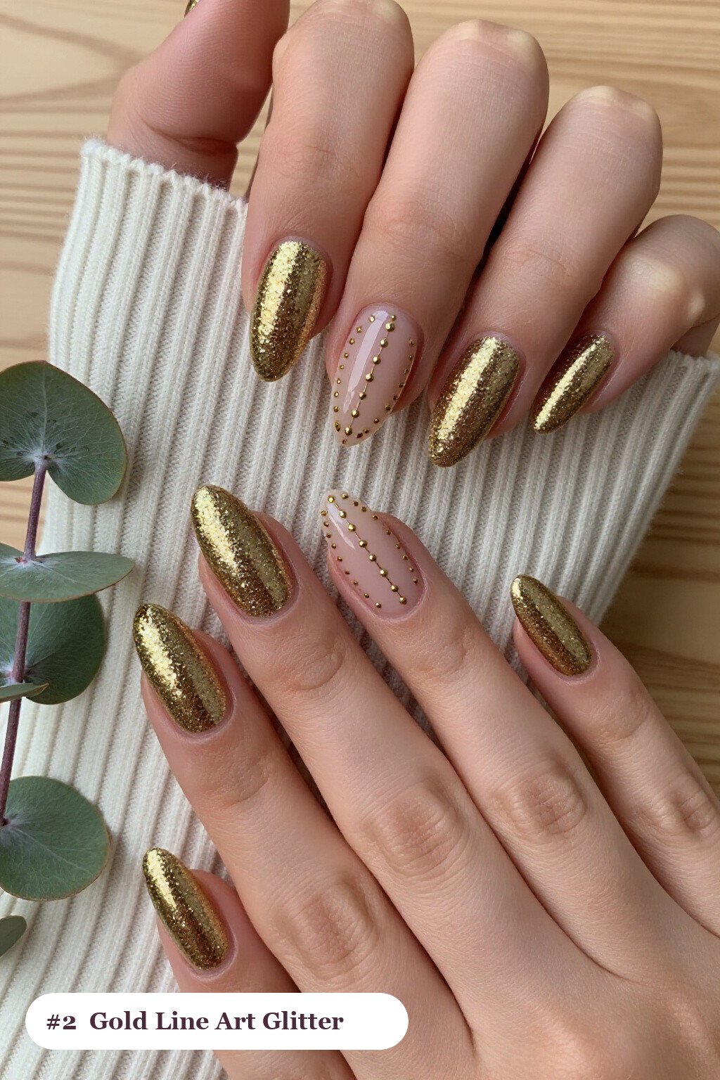 Long ballerina gold glitter nails with sparkling glitter clearly visible on every nail, styled with fine gold line art and tiny dots drawn across every nail, perfect for christmas - christmas glitter nails
