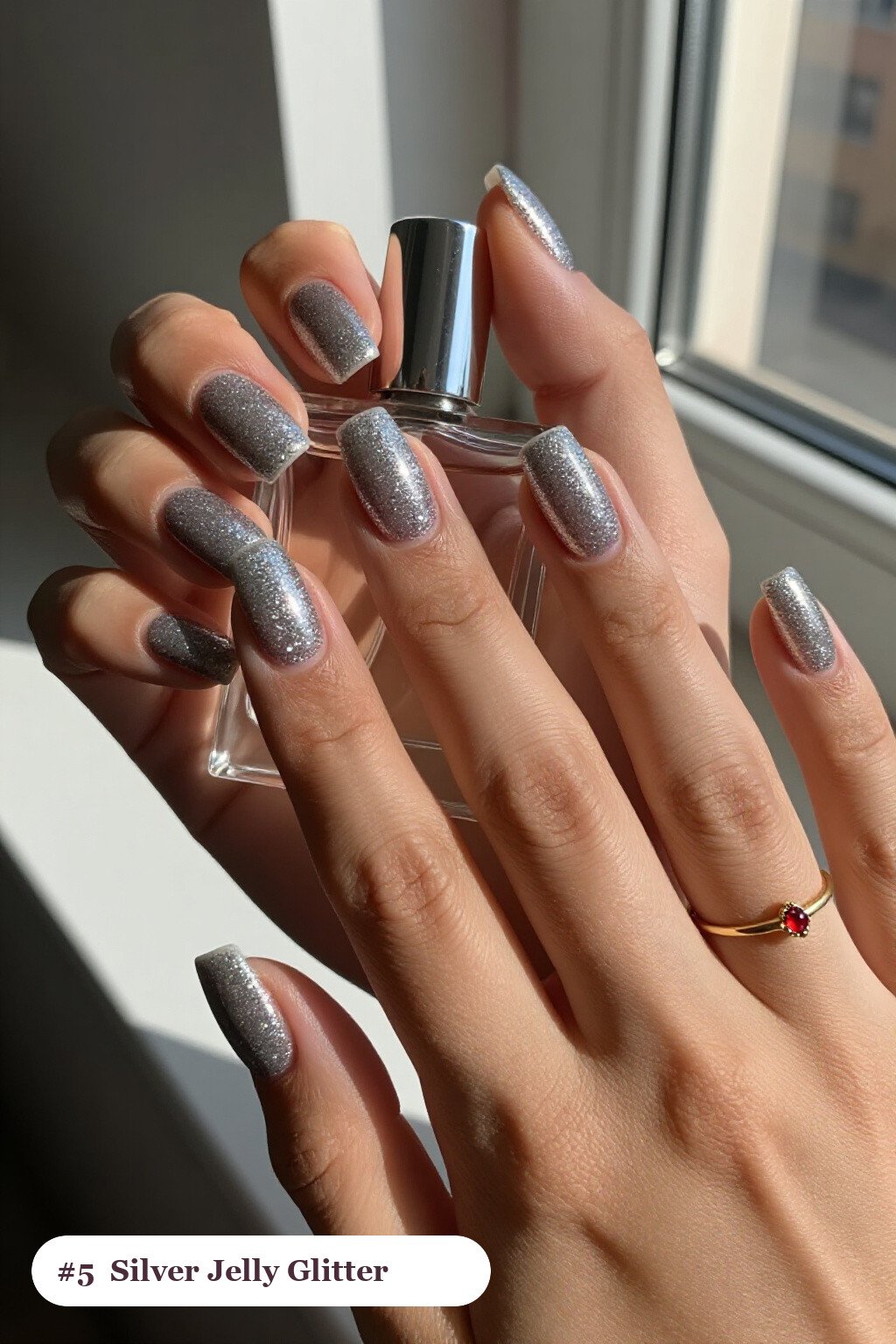 Medium square silver glitter nails with sparkling glitter clearly visible on every nail, styled with a see-through jelly finish with encapsulated glitter, perfect for christmas - christmas glitter nails