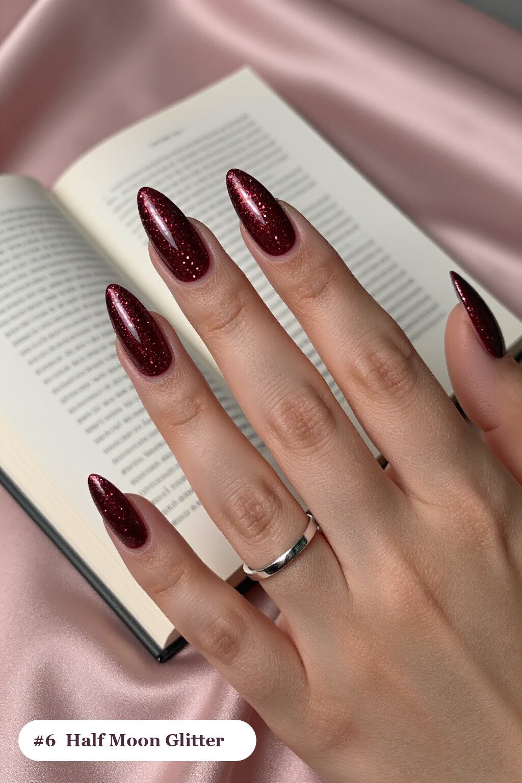 Long coffin burgundy glitter nails with sparkling glitter clearly visible on every nail, styled with a half-moon design with a glitter crescent at the cuticle, perfect for christmas - christmas glitter nails