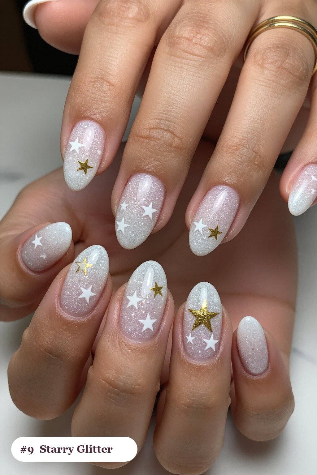 Medium coffin snow white glitter nails with sparkling glitter clearly visible on every nail, styled with white and gold stars and sparkles painted on every nail, perfect for christmas - christmas glitter nails