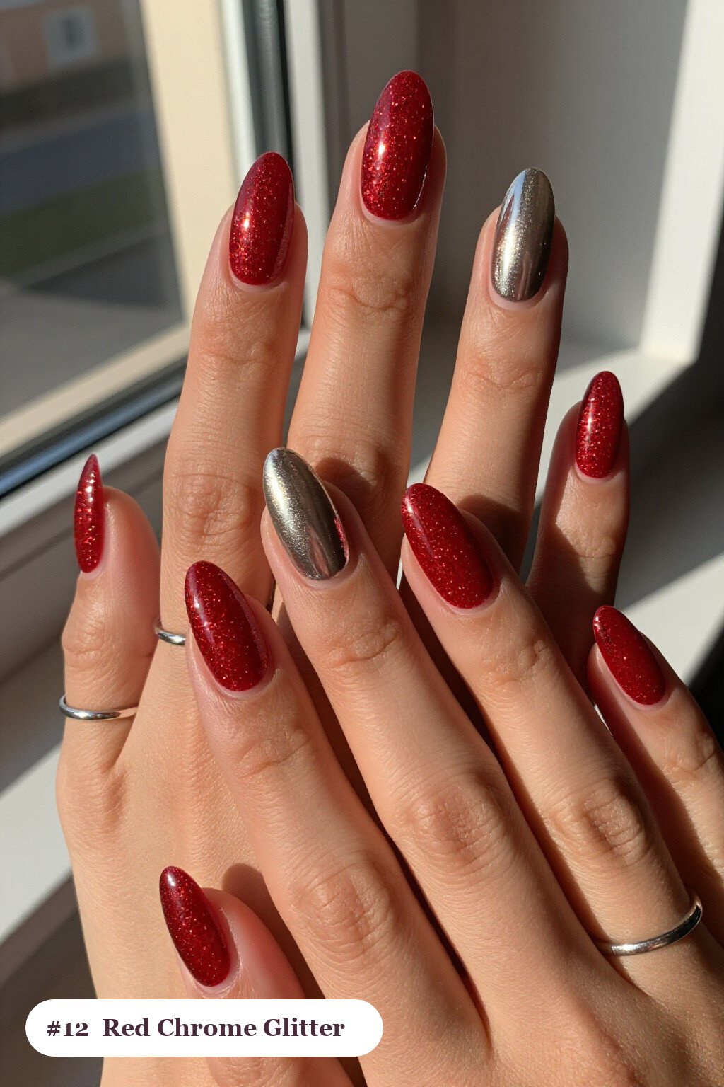 Medium almond glitter red nails with sparkling glitter clearly visible on every nail, styled with a liquid chrome mirror finish and bright metallic highlights, with silver chrome details, perfect for christmas - christmas glitter nails red