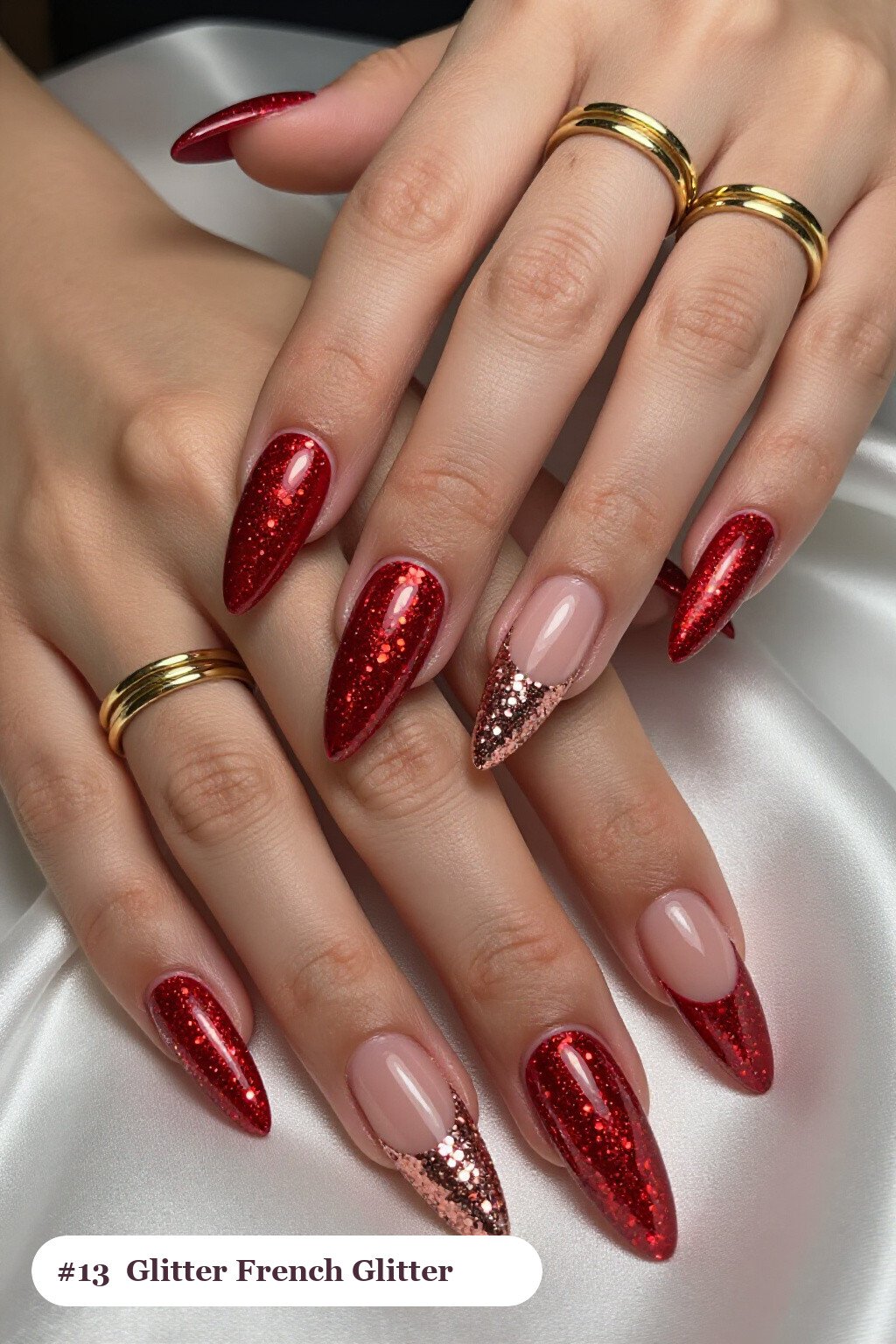 Long stiletto glitter red nails with sparkling glitter clearly visible on every nail, styled with glitter-packed french tips over a sheer nude base, with rose gold details, perfect for christmas - christmas glitter nails red