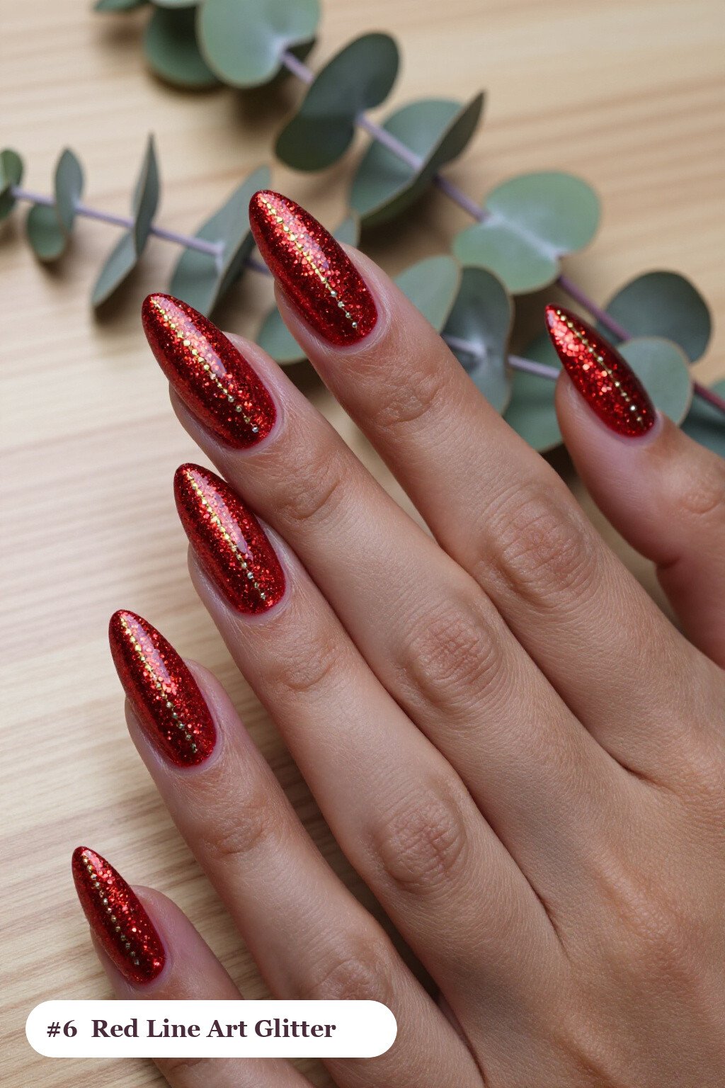 Long almond glitter red nails with sparkling glitter clearly visible on every nail, styled with fine gold line art and tiny dots drawn across every nail, with silver details, perfect for christmas - christmas glitter nails red