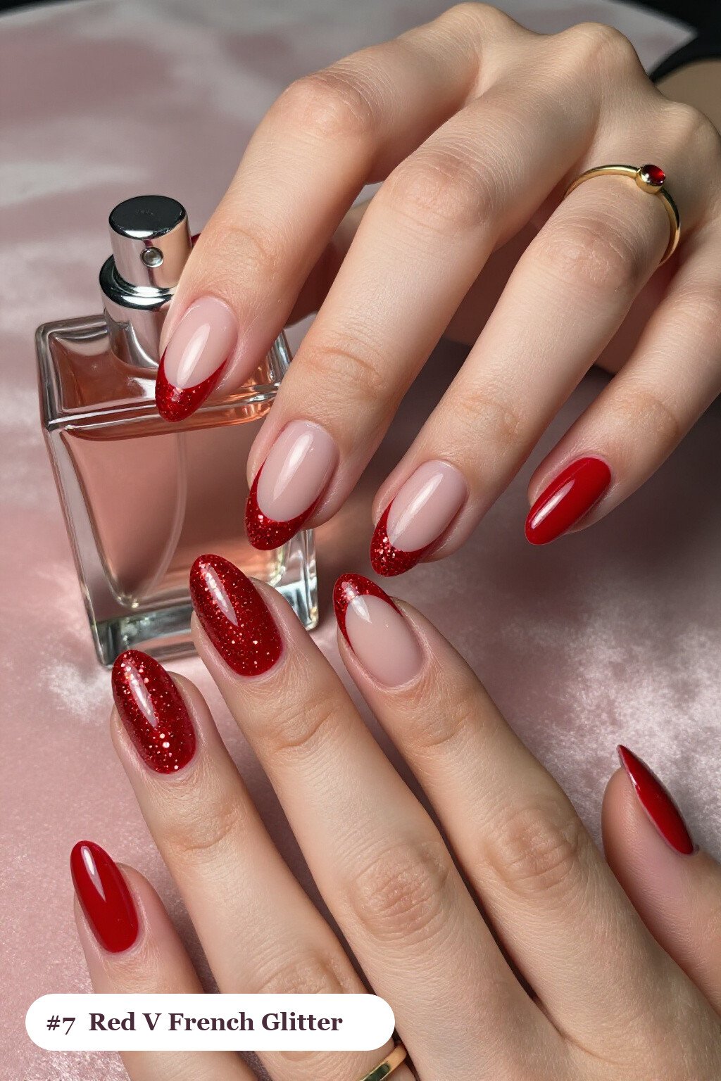 Medium oval glitter red nails with sparkling glitter clearly visible on every nail, styled with deep V-shaped french tips in a bold contrasting colour, with soft nude details, perfect for christmas - christmas glitter nails red