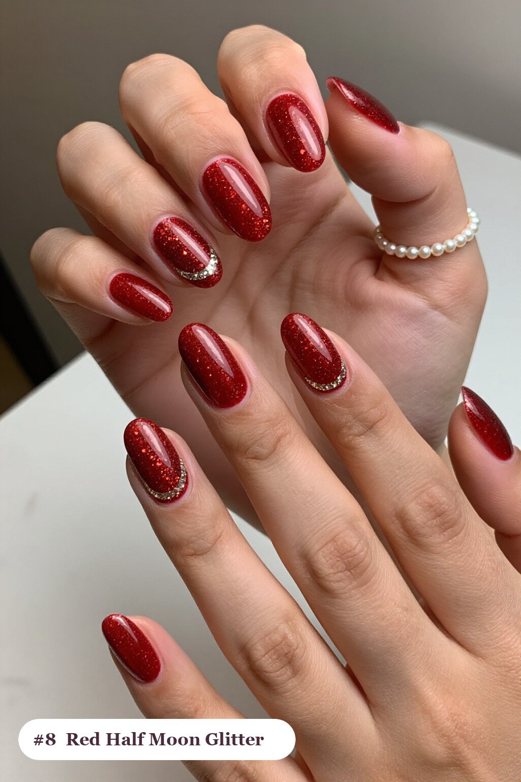 Medium coffin glitter red nails with sparkling glitter clearly visible on every nail, styled with a half-moon design with a glitter crescent at the cuticle, with champagne details, perfect for christmas - christmas glitter nails red
