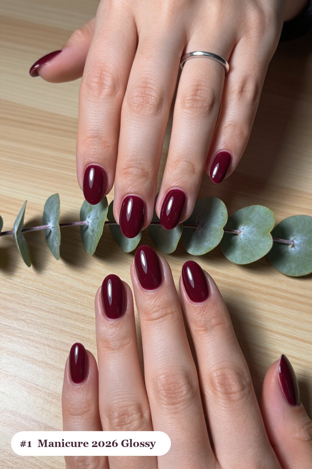 Mirror‑Gloss Burgundy Oval Nails: A Show‑Stopping Holiday Statement - christmas manicure ideas 2026