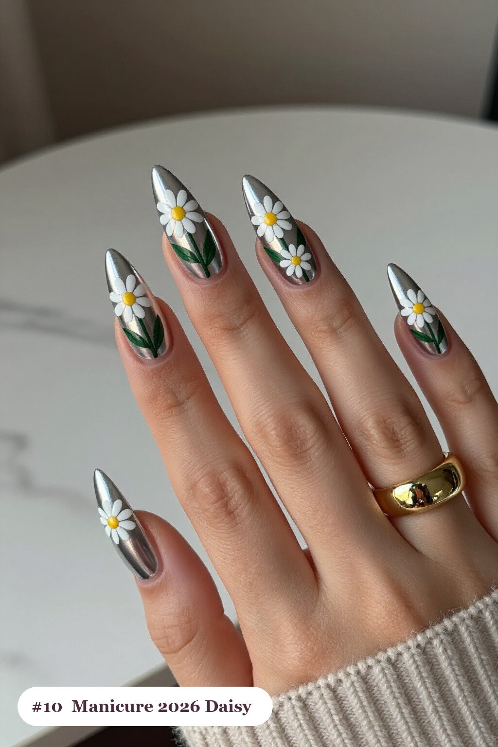 Silver Stiletto Nails with Hand‑Painted Daisies and Green Leaves: How to Make Them Last Longer - christmas manicure ideas 2026