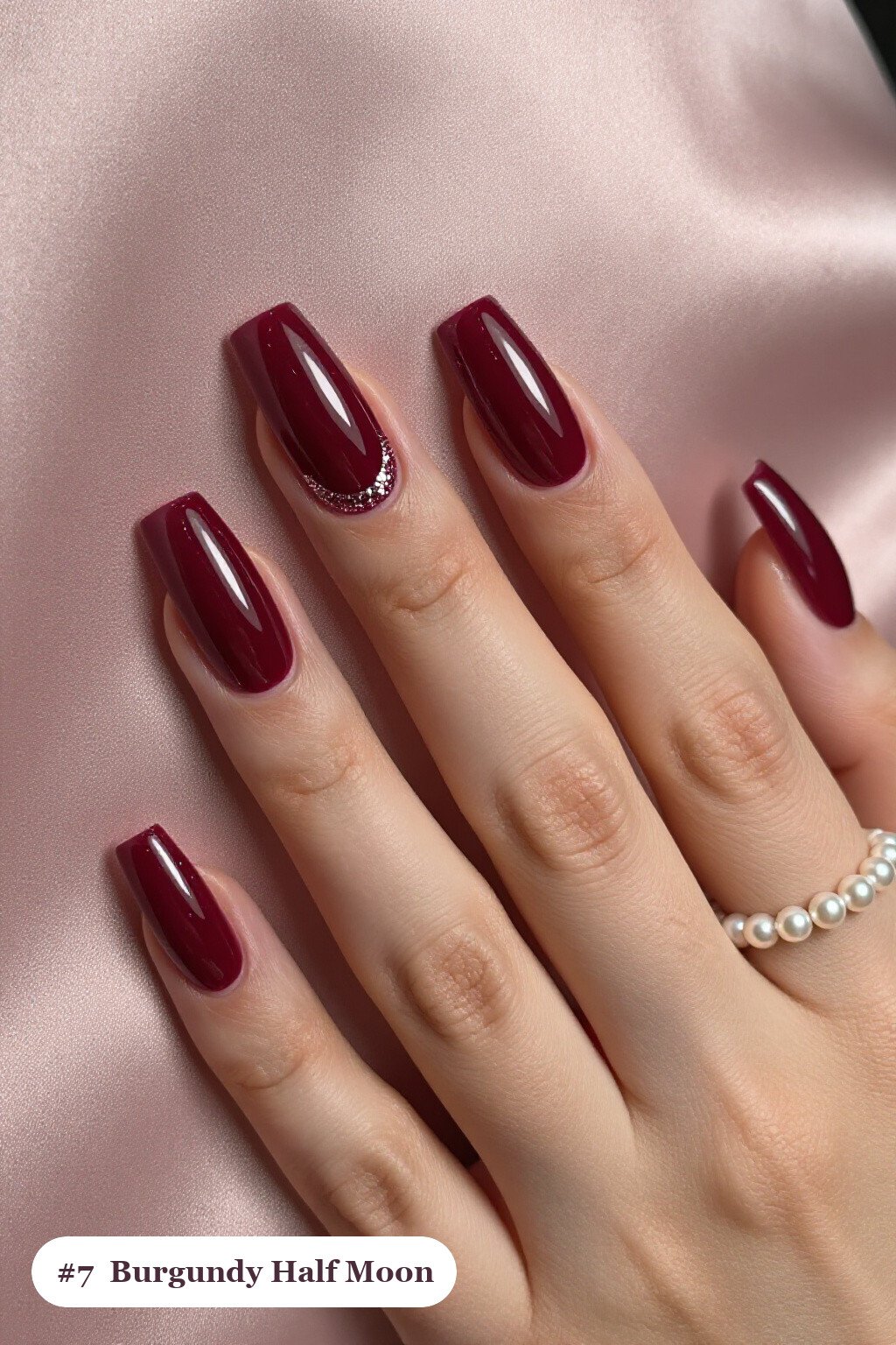 Long square burgundy nails in a half-moon design with a glitter crescent at the cuticle, perfect for christmas - christmas nail designs holiday