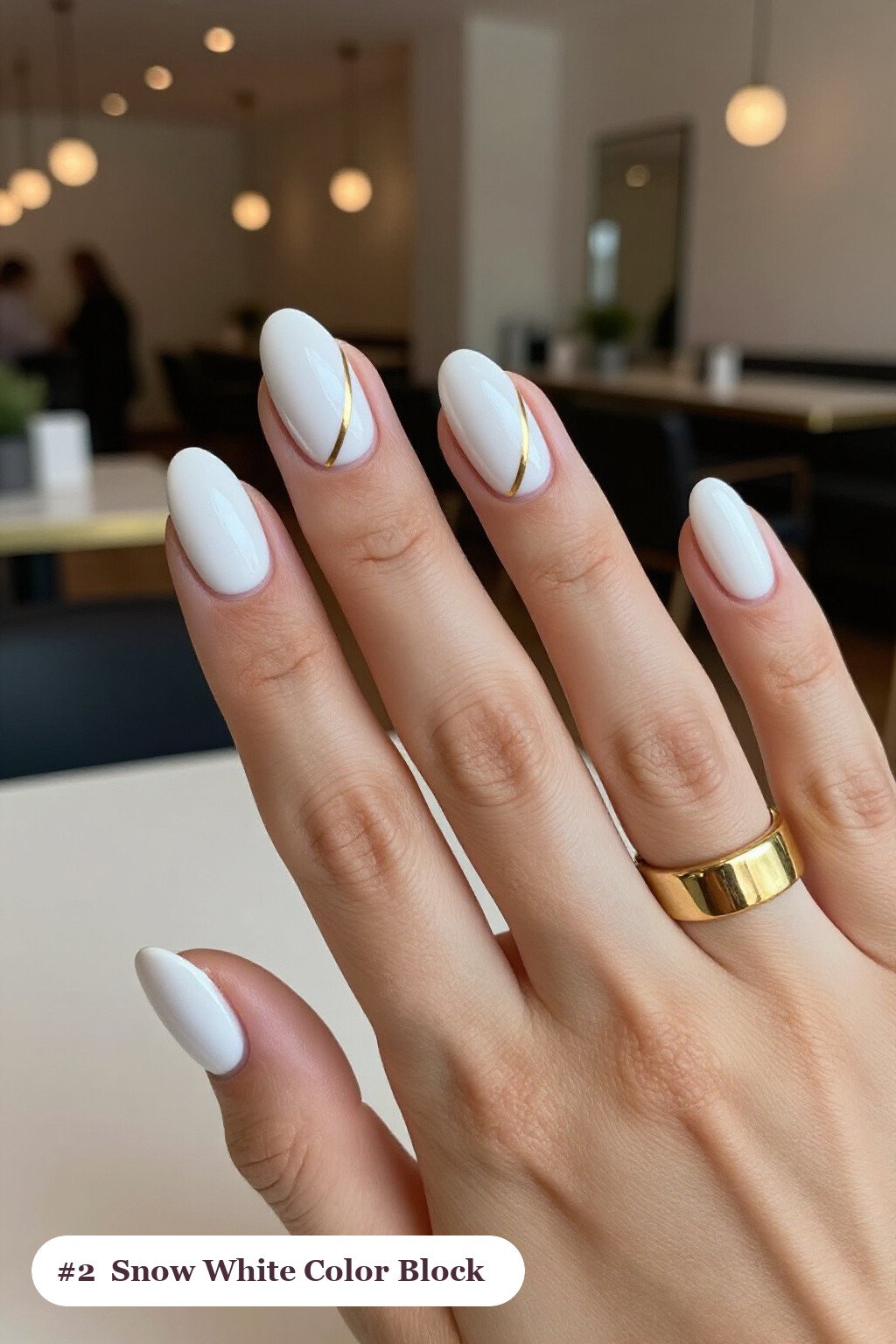 Snow‑White Oval Color‑Block with Gold Divider: Chic Festive Nails - christmas nails