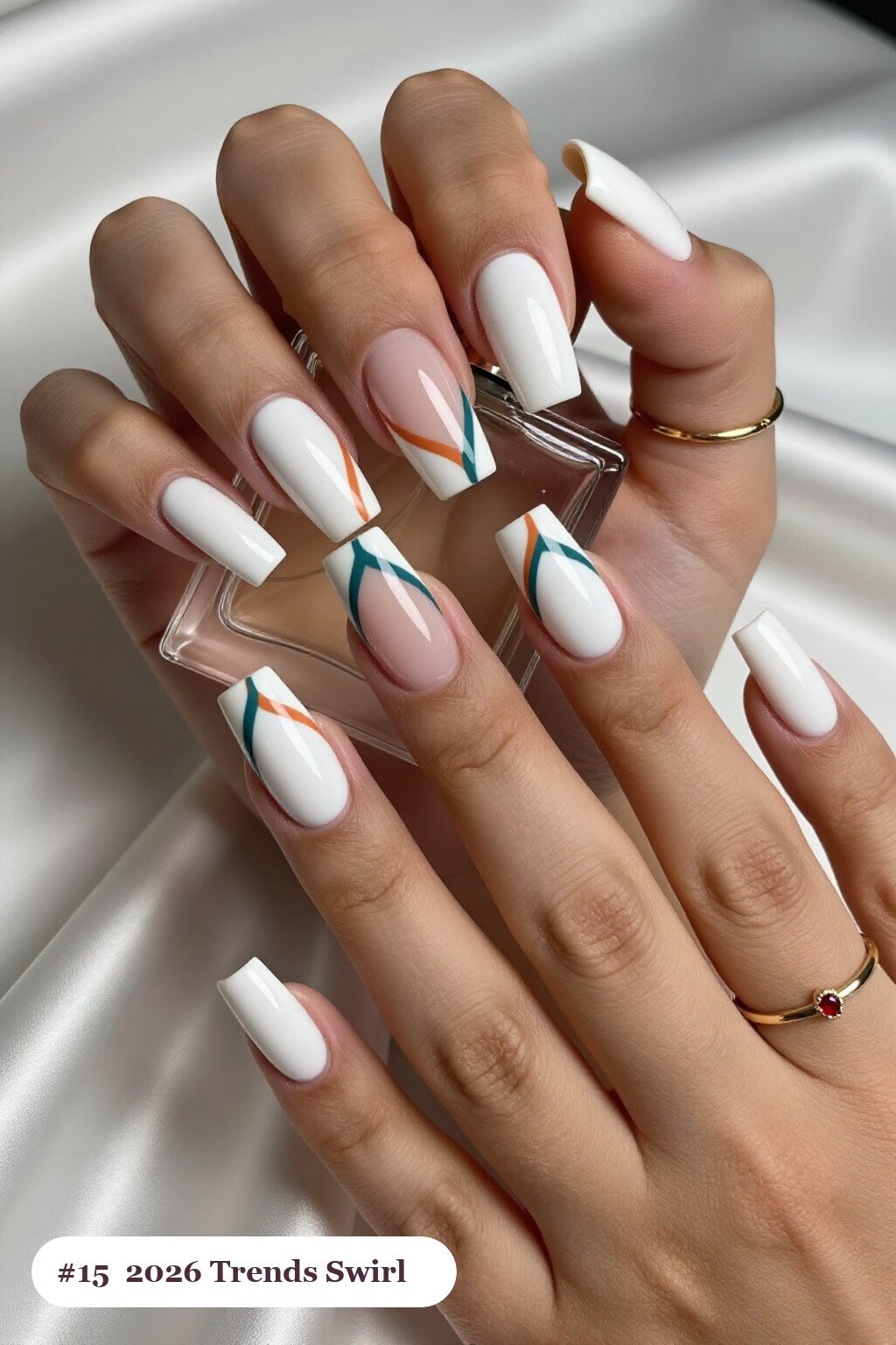 Long square snow white 2026 trends nails with bold hand-painted swirl lines flowing across every nail in a contrasting colour, perfect for christmas - christmas nails 2026 trends