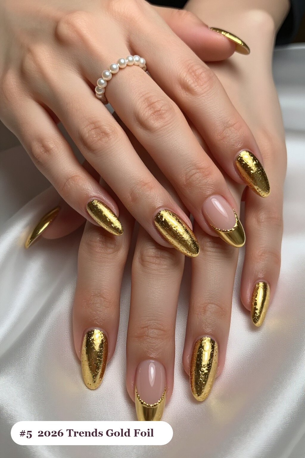 Long square gold 2026 trends nails with dense gold foil flakes and gold leaf scattered across every nail, perfect for christmas - christmas nails 2026 trends