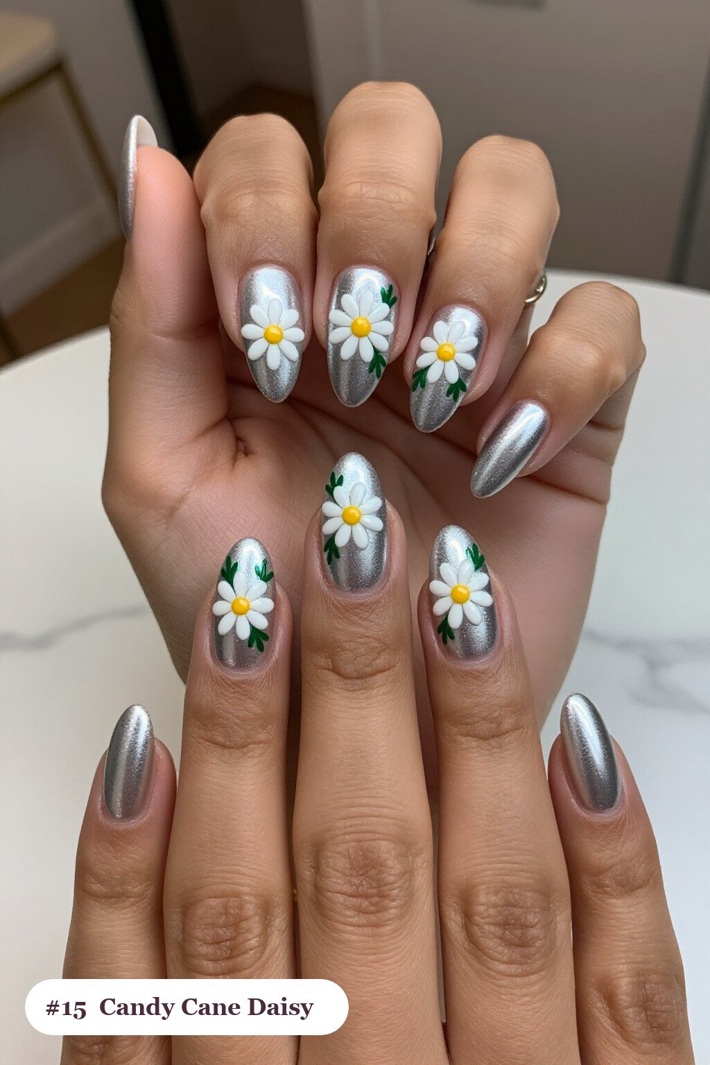 Silver Almond Nails with Hand‑Painted Daisies & Green Leaves - christmas nails candy cane