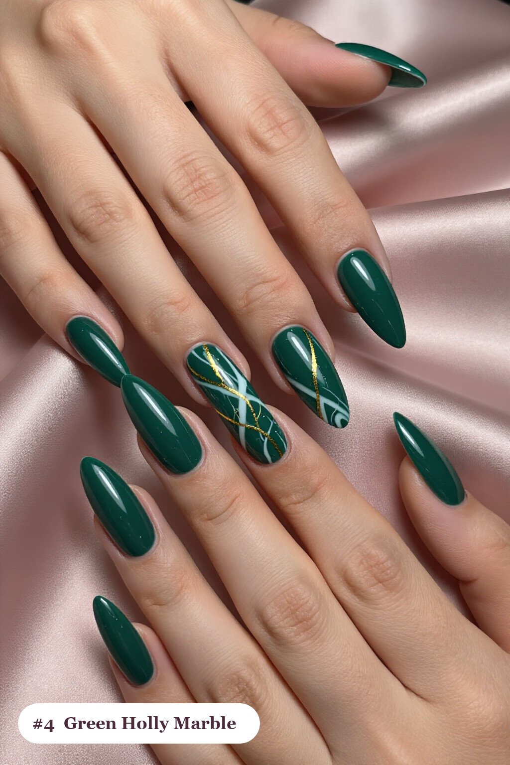Emerald Green Stiletto Nails Featuring Bold White‑Gold Marble Veins for Festive Flair - christmas nails holly
