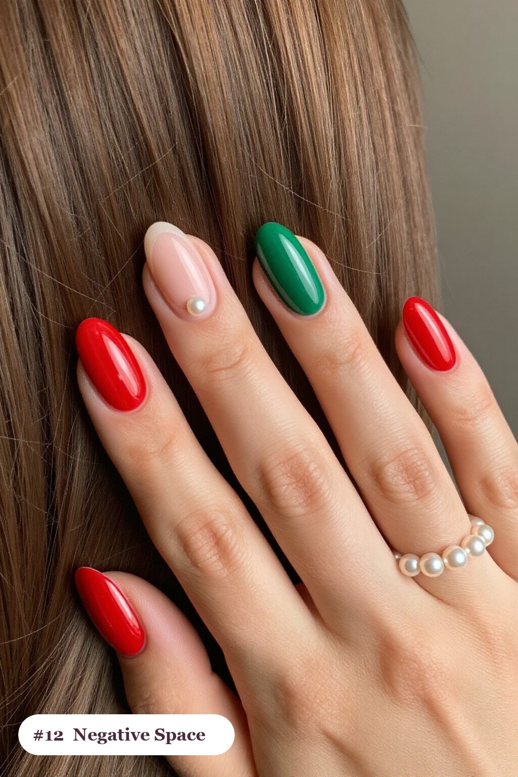 Medium oval red green nails in a negative-space design with sheer nude windows and bold colour shapes, with pearl details, perfect for christmas - christmas nails red and green