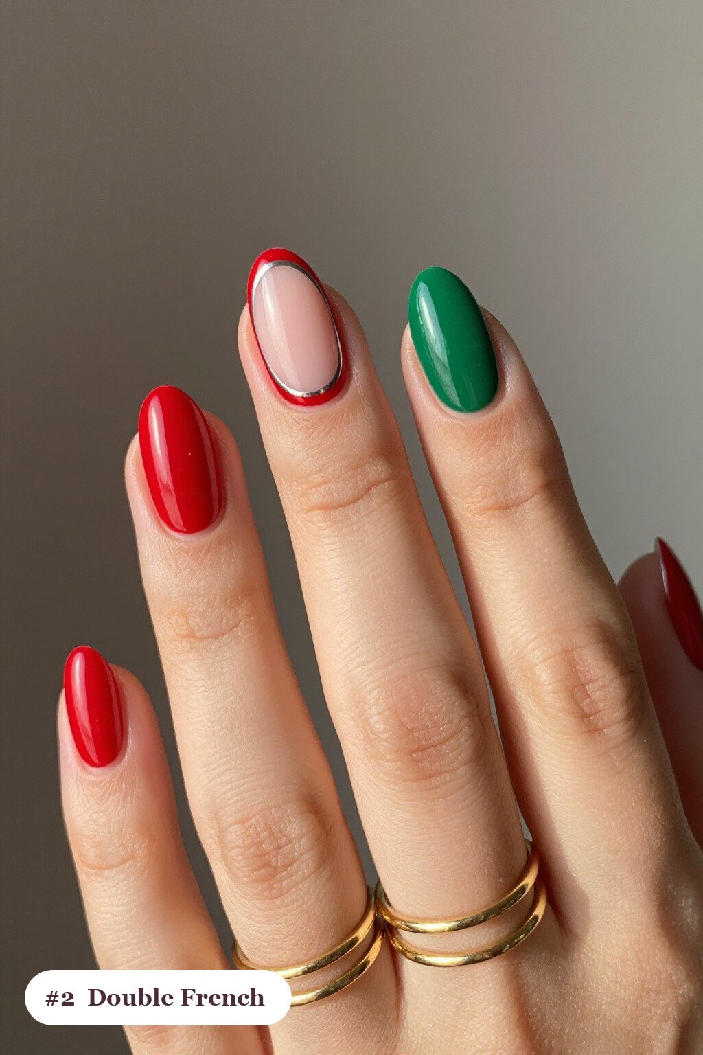 Medium oval red green nails with double-line french tips in two colours, with silver chrome details, perfect for christmas - christmas nails red and green