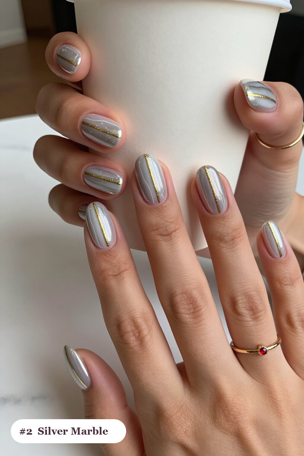 Silver Almond Nails with Bold Marble Veins in White and Gold - christmas nails short