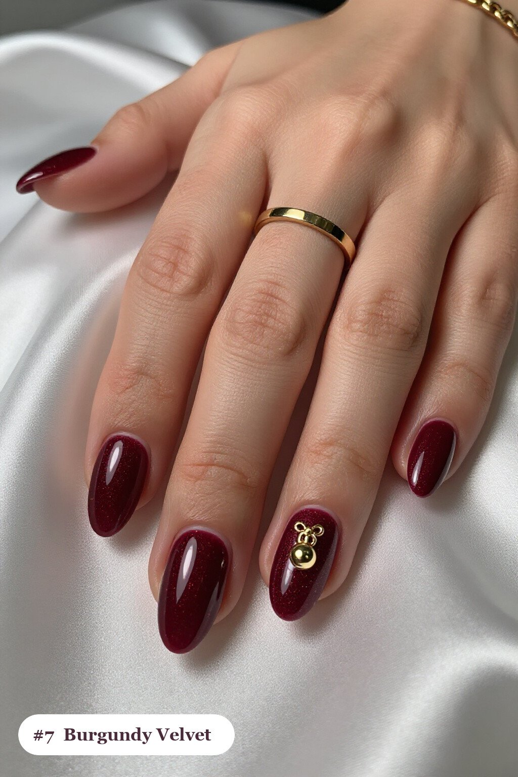 Velvet Shimmer Burgundy Almond Nails with Gold Charm Accent: Best Shades for Every Season - christmas nails short