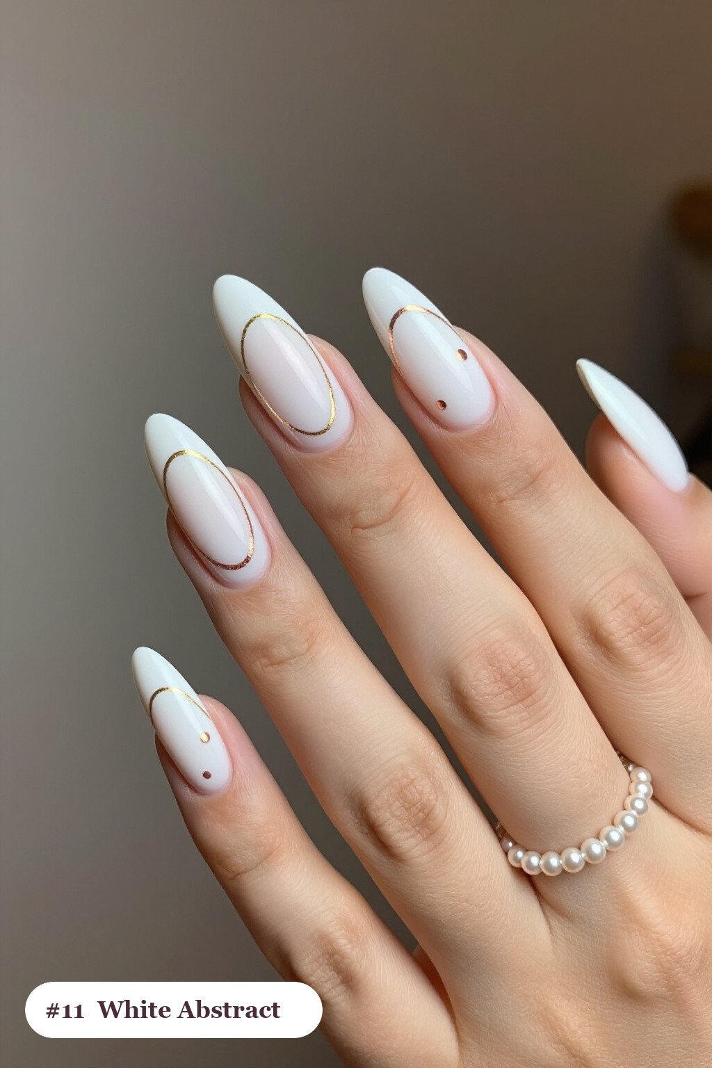 Abstract Colour Blob Art with Gold Outlines on Almond Nails - christmas nails white