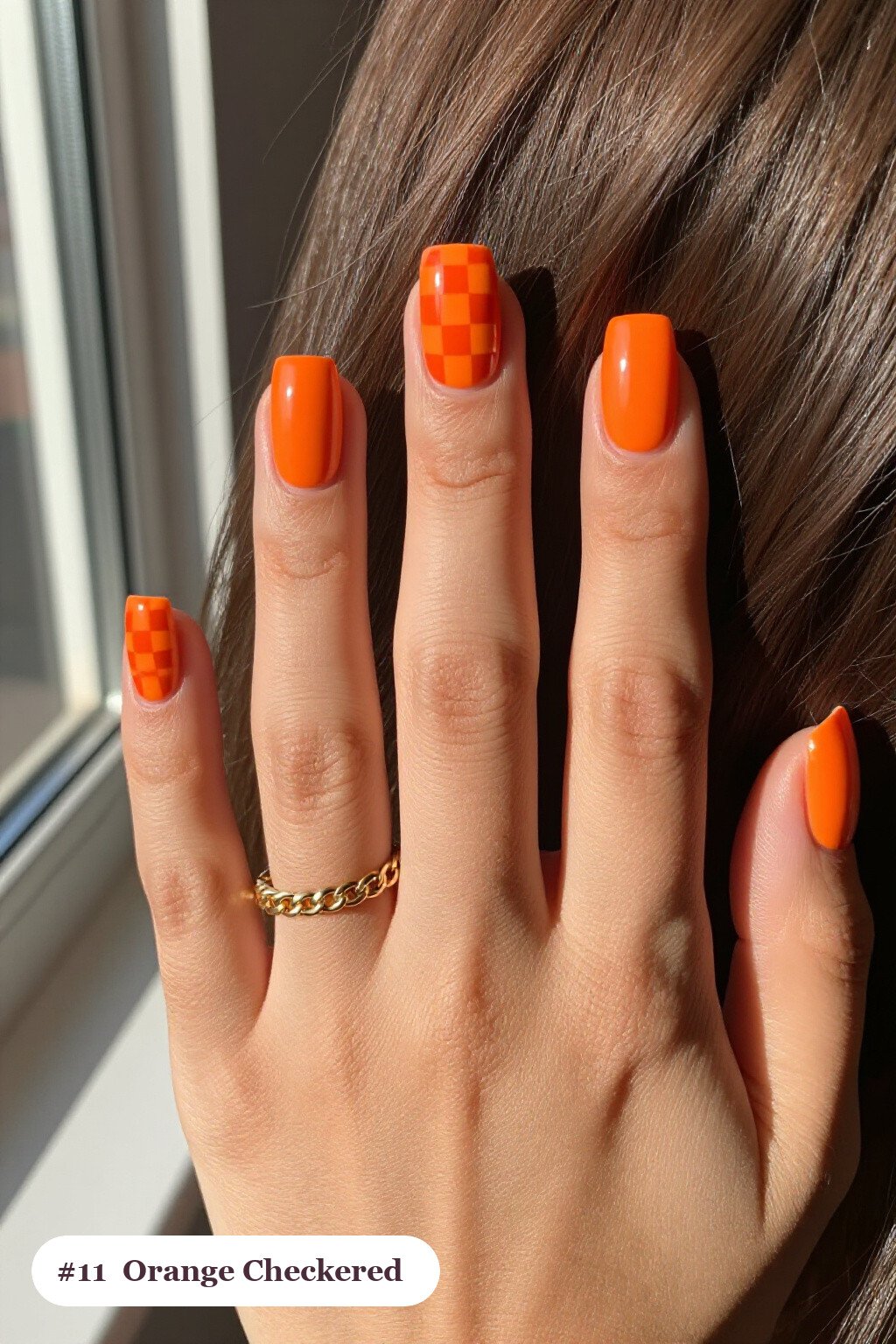 Orange Square Nails with Bold Checkerboard Accent Pattern - classy halloween nails