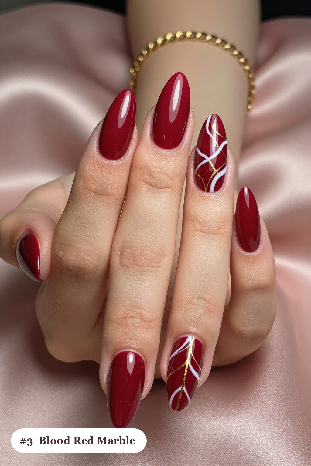Blood‑Red Almond Nails with White‑Gold Marble Veins: Classy Halloween Nails Elegance - classy halloween nails