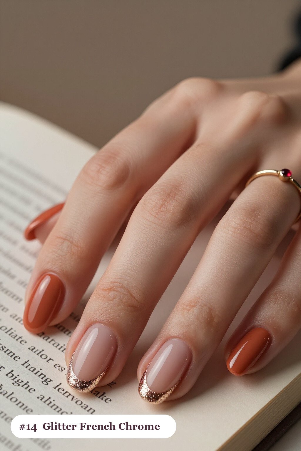 Medium oval coral coffee chrome nails with a liquid chrome mirror finish clearly visible on every nail, styled with glitter-packed french tips over a sheer nude base - coffee chrome nails