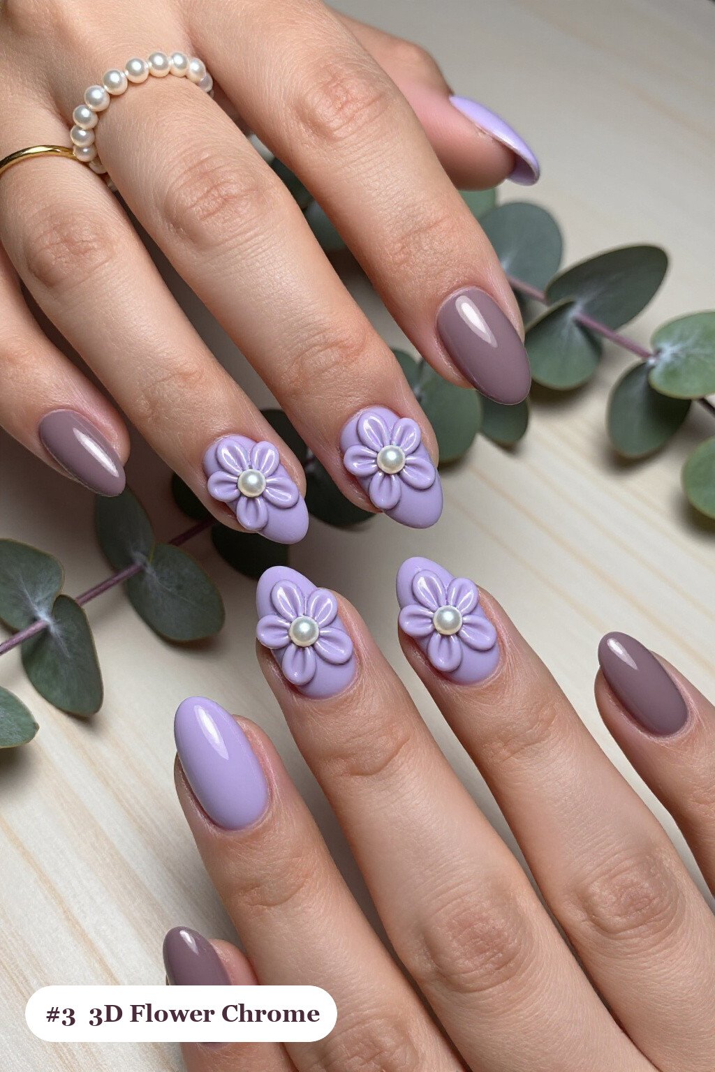 Medium coffin lavender coffee chrome nails with a liquid chrome mirror finish clearly visible on every nail, styled with raised 3D flowers with pearl centres on two accent nails - coffee chrome nails