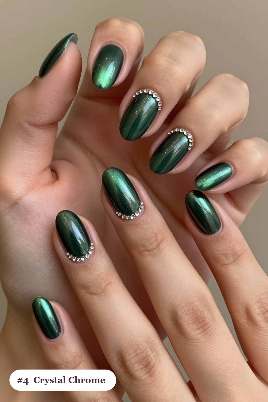 Medium oval emerald green coffee chrome nails with a liquid chrome mirror finish clearly visible on every nail, styled with rows of sparkling crystal rhinestones along the cuticle of every nail - coffee chrome nails