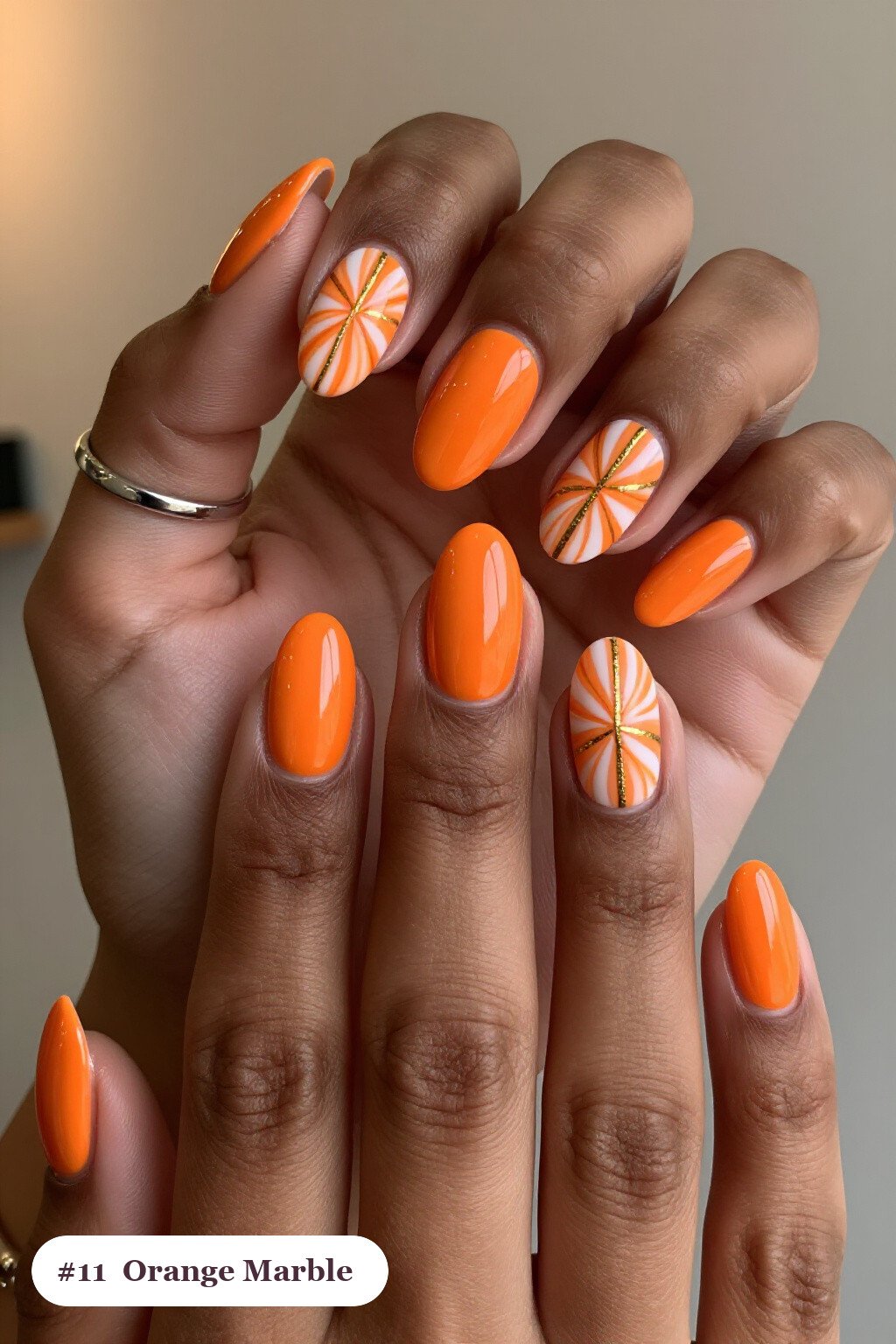Orange Coffin Nails Showcasing Bold White & Gold Marble Veins - coffin halloween nails