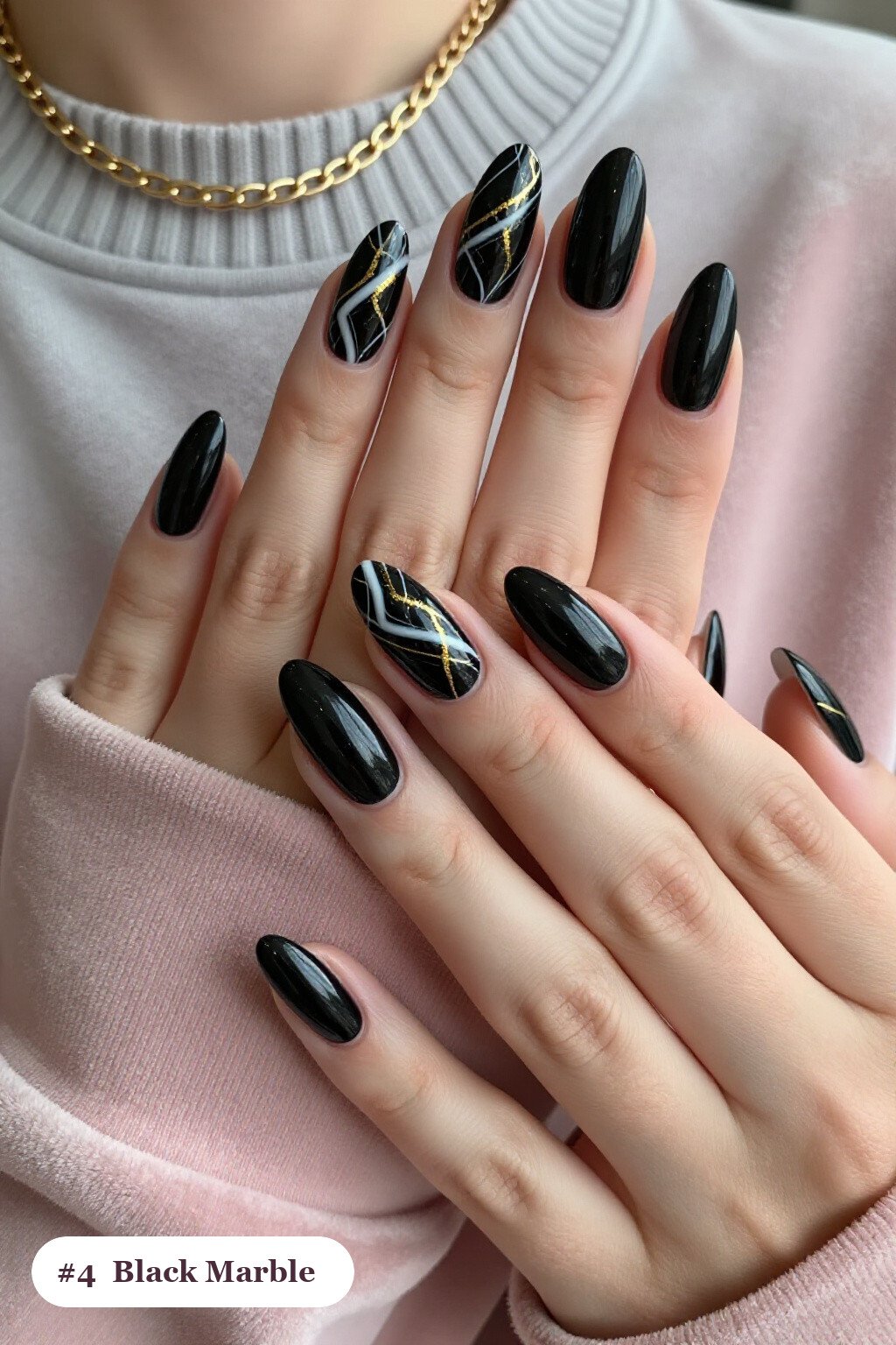 Medium Almond Black Nails Showcasing Bold White and Gold Marble Veins - cute halloween nails