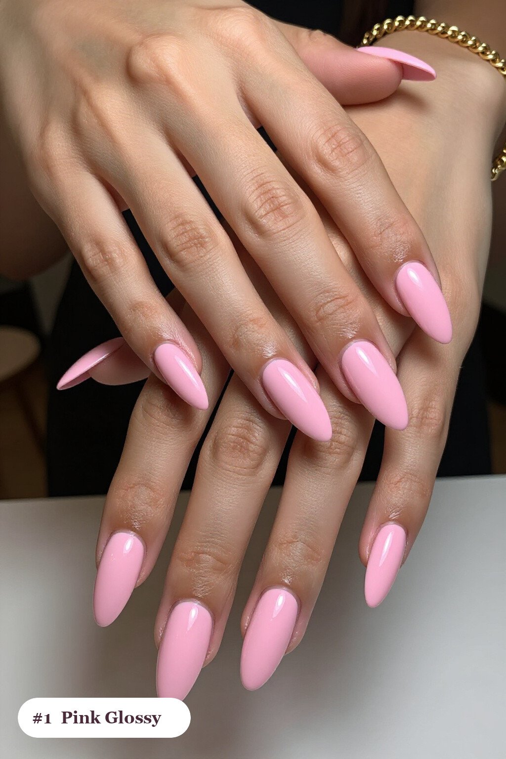 Long almond pink nails in a flawless mirror-glossy full-colour finish, perfect for halloween - cute halloween nails pink