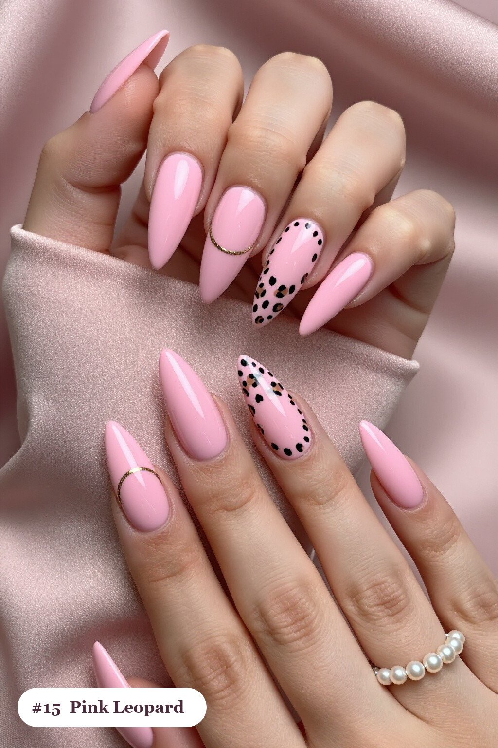 Long stiletto pink nails with a leopard print pattern on two accent nails and solid colour on the rest, with champagne details, perfect for halloween - cute halloween nails pink