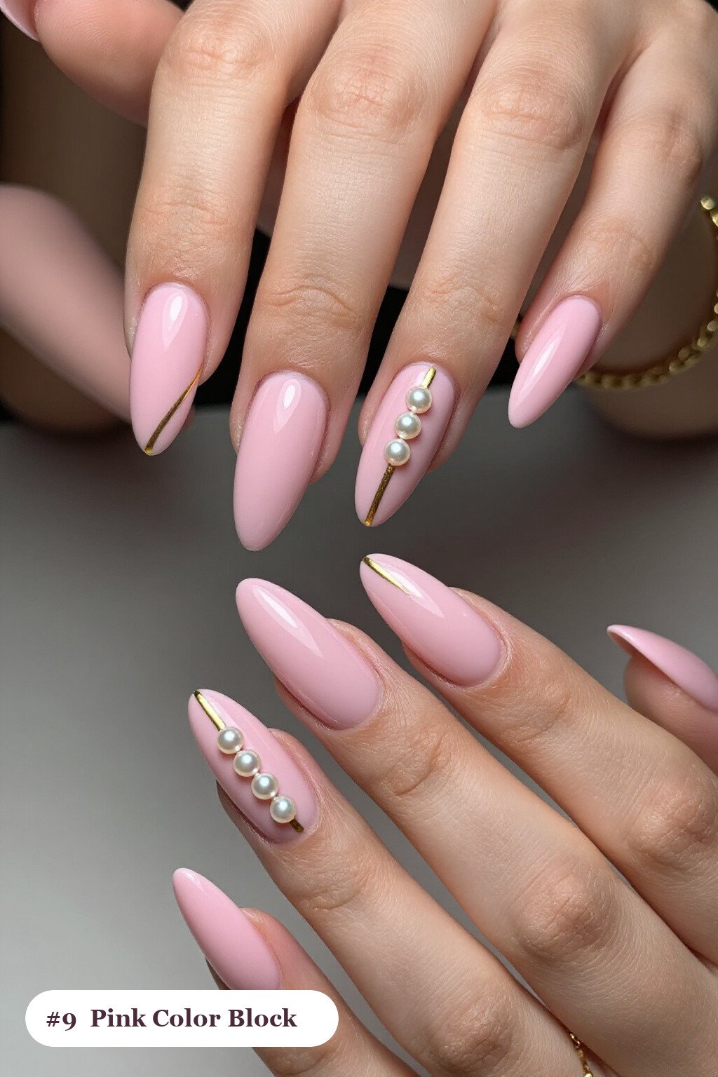 Long ballerina pink nails in a colour-block design split diagonally with a thin gold line, with pearl details, perfect for halloween - cute halloween nails pink