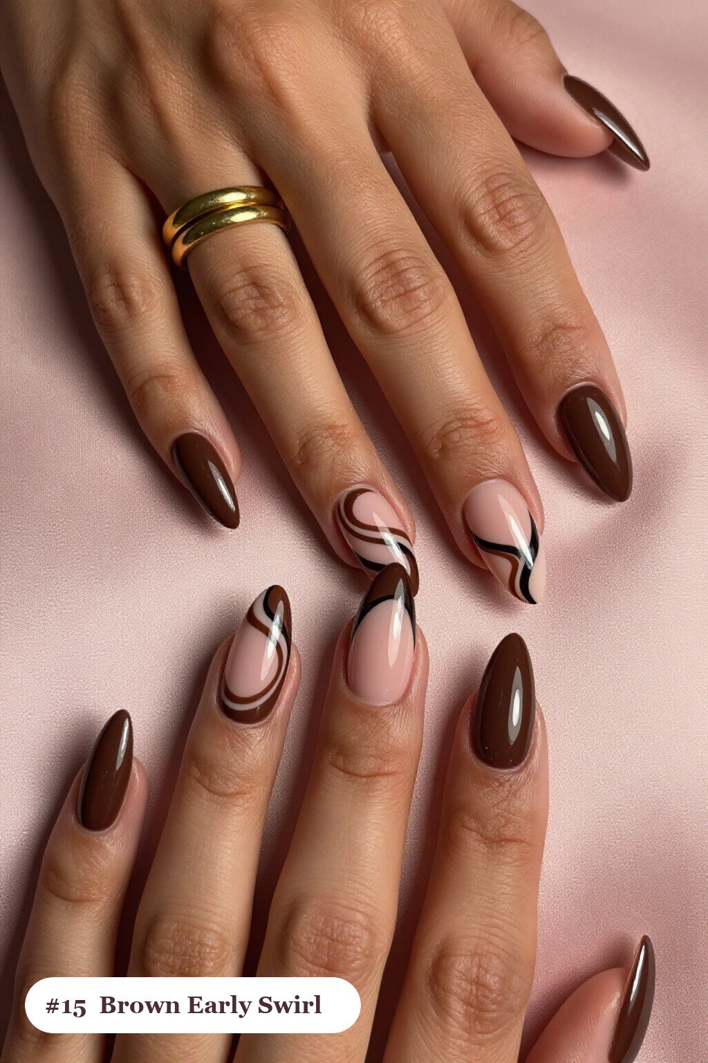 Long stiletto chocolate brown early nails with bold hand-painted swirl lines flowing across every nail in a contrasting colour, perfect for fall - early fall nail designs