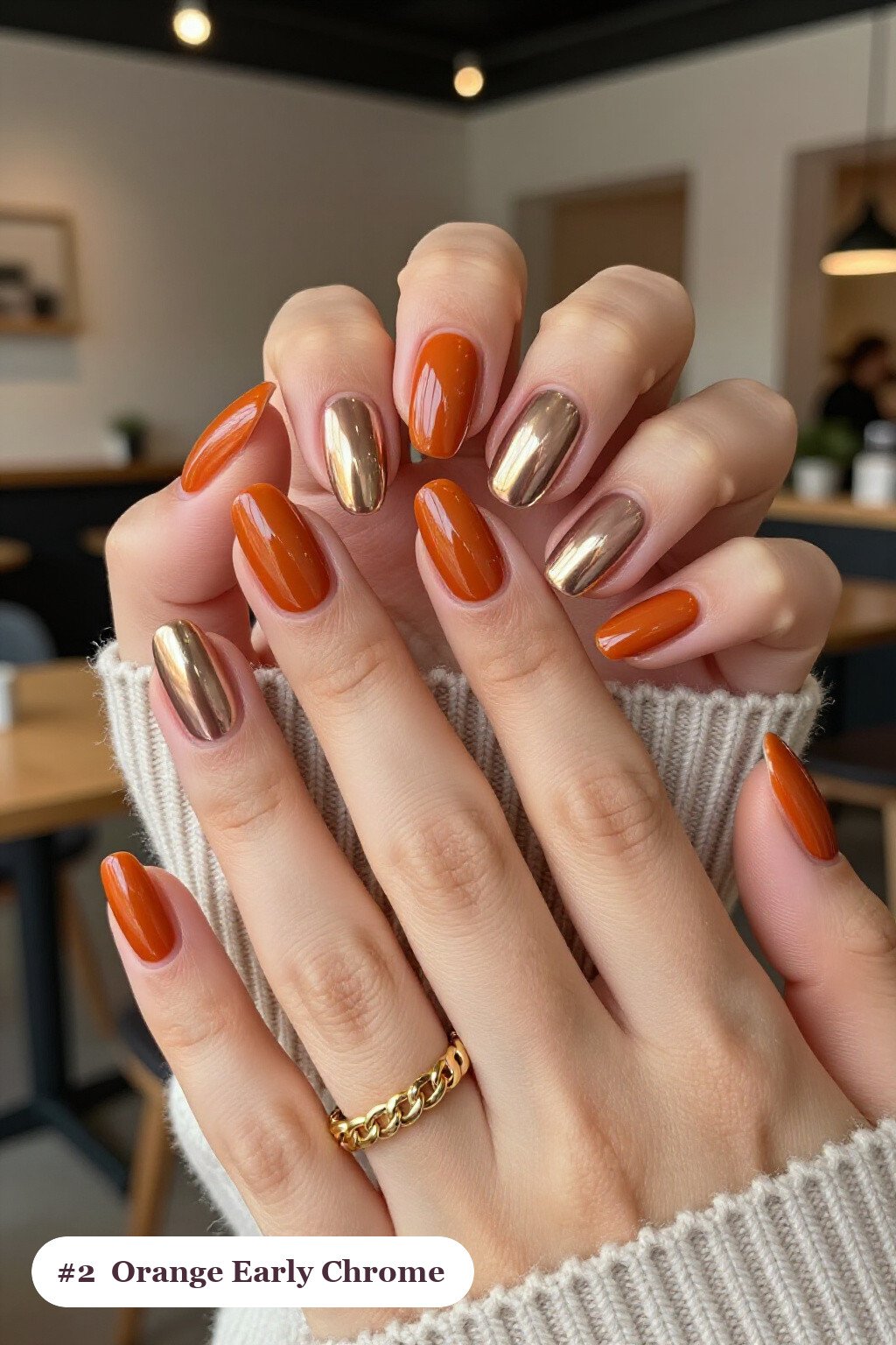Medium almond burnt orange early nails with a liquid chrome mirror finish and bright metallic highlights, perfect for fall - early fall nail designs