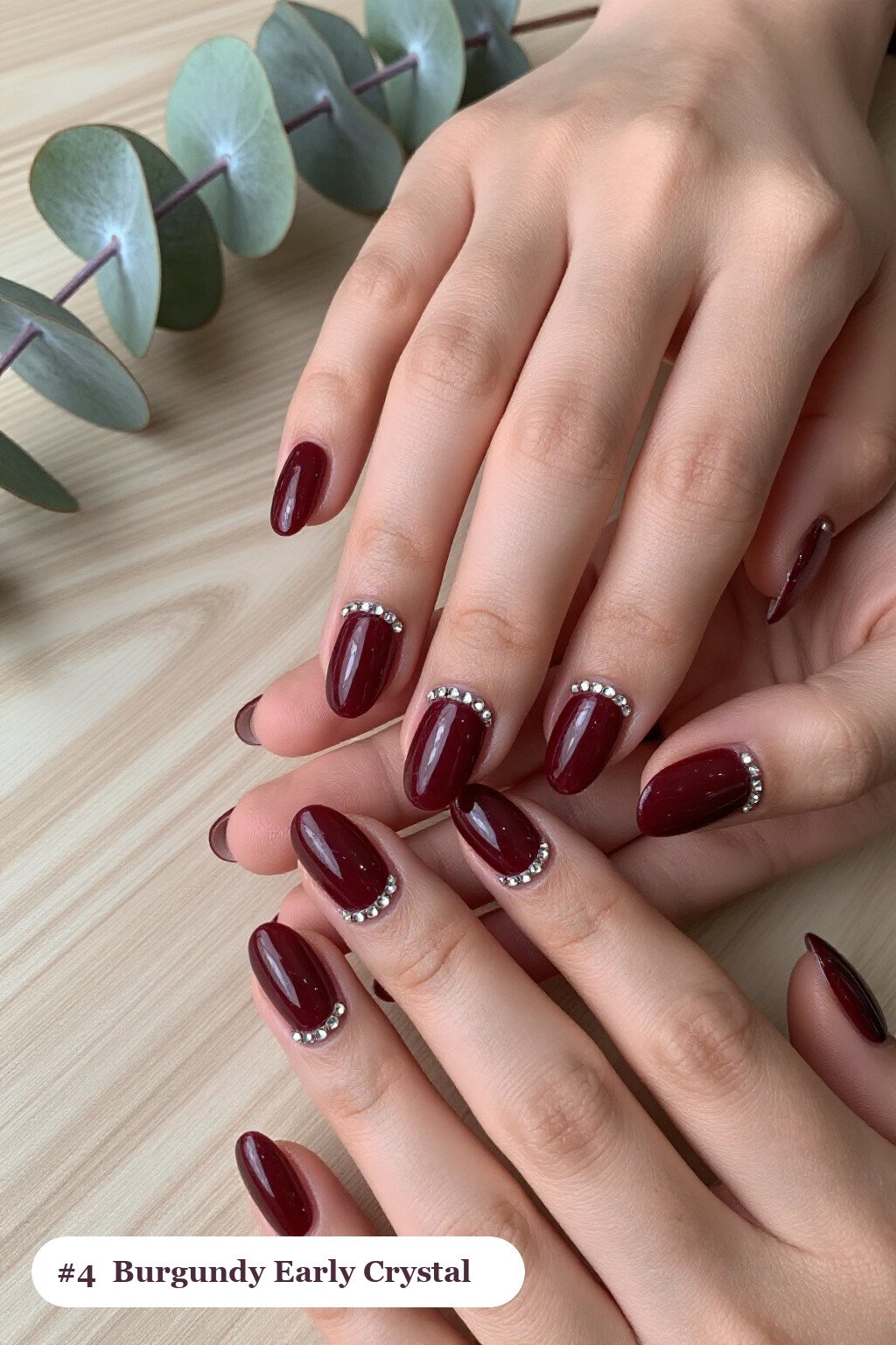 Medium coffin burgundy early nails with rows of sparkling crystal rhinestones along the cuticle of every nail, perfect for fall - early fall nail designs